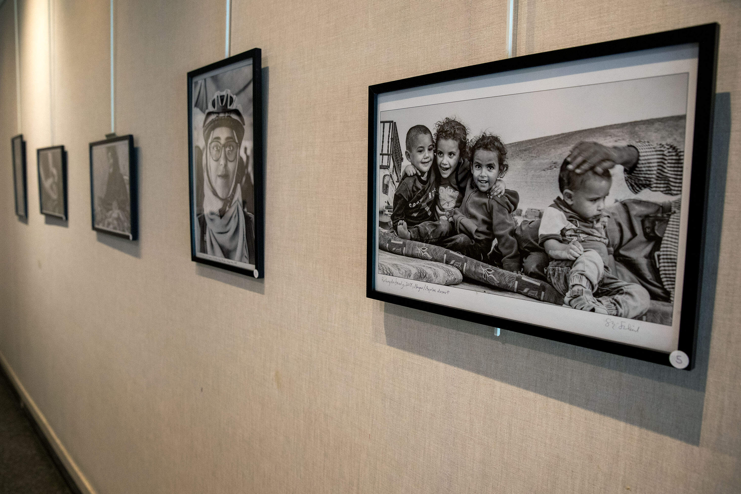 A photograph titled &quot;Rashayda family, 2018, Negev/Aqaba desert&quot; in photographer Skip Shiel's exhibit at Newton Free Library. (Robin Lubbock/WBUR)