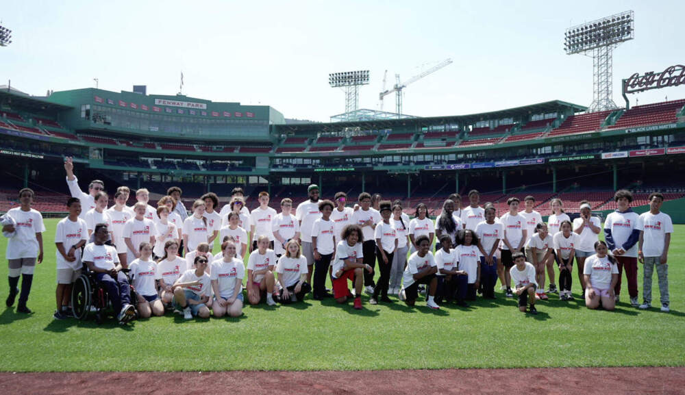 Seventh and eighth grade honor roll students at Fenway Park in preparation for the kickball game. (Sydney Ko/WBUR)
