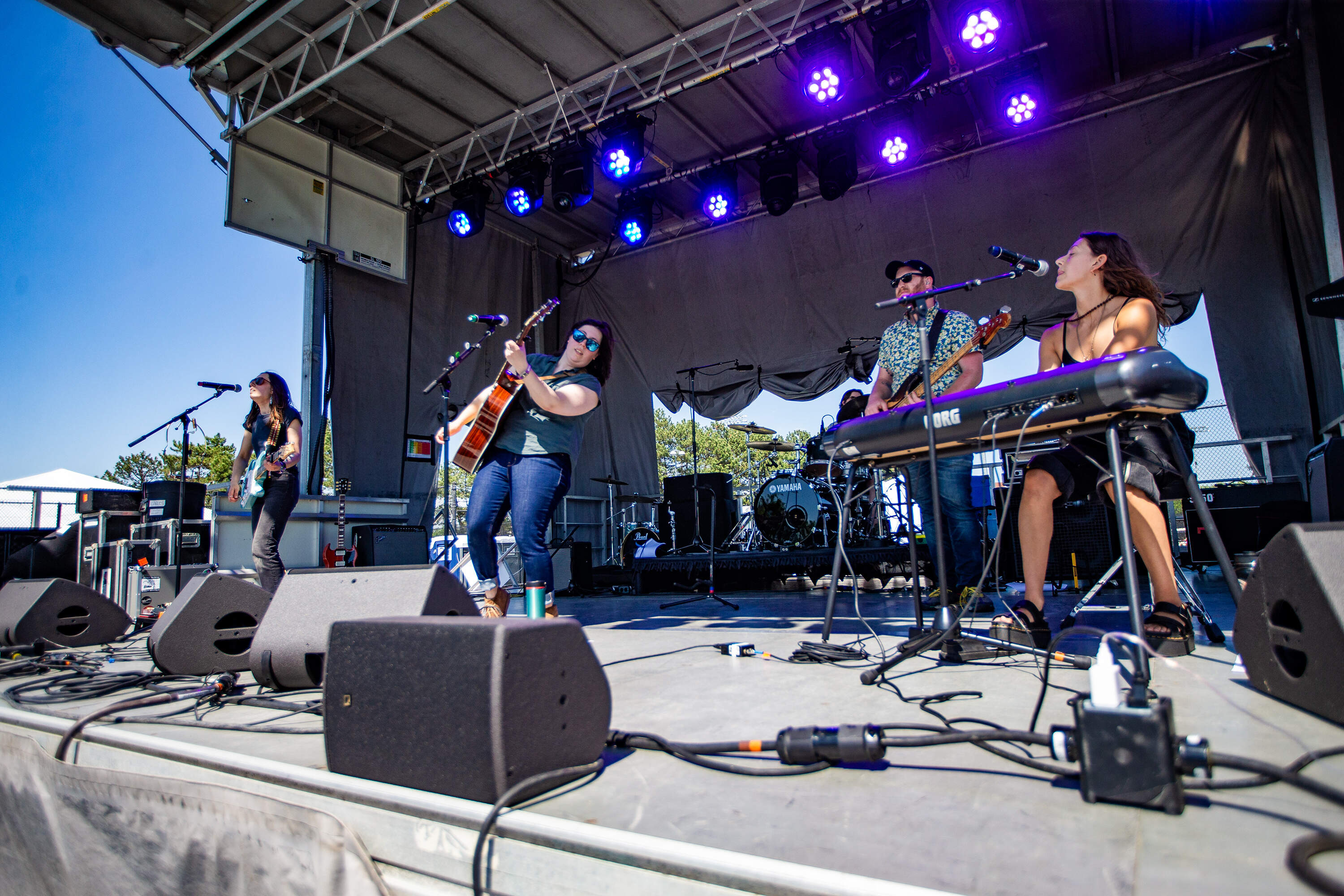 Local band The Wolff Sisters takes the Orange Stage. (Jesse Costa/WBUR)