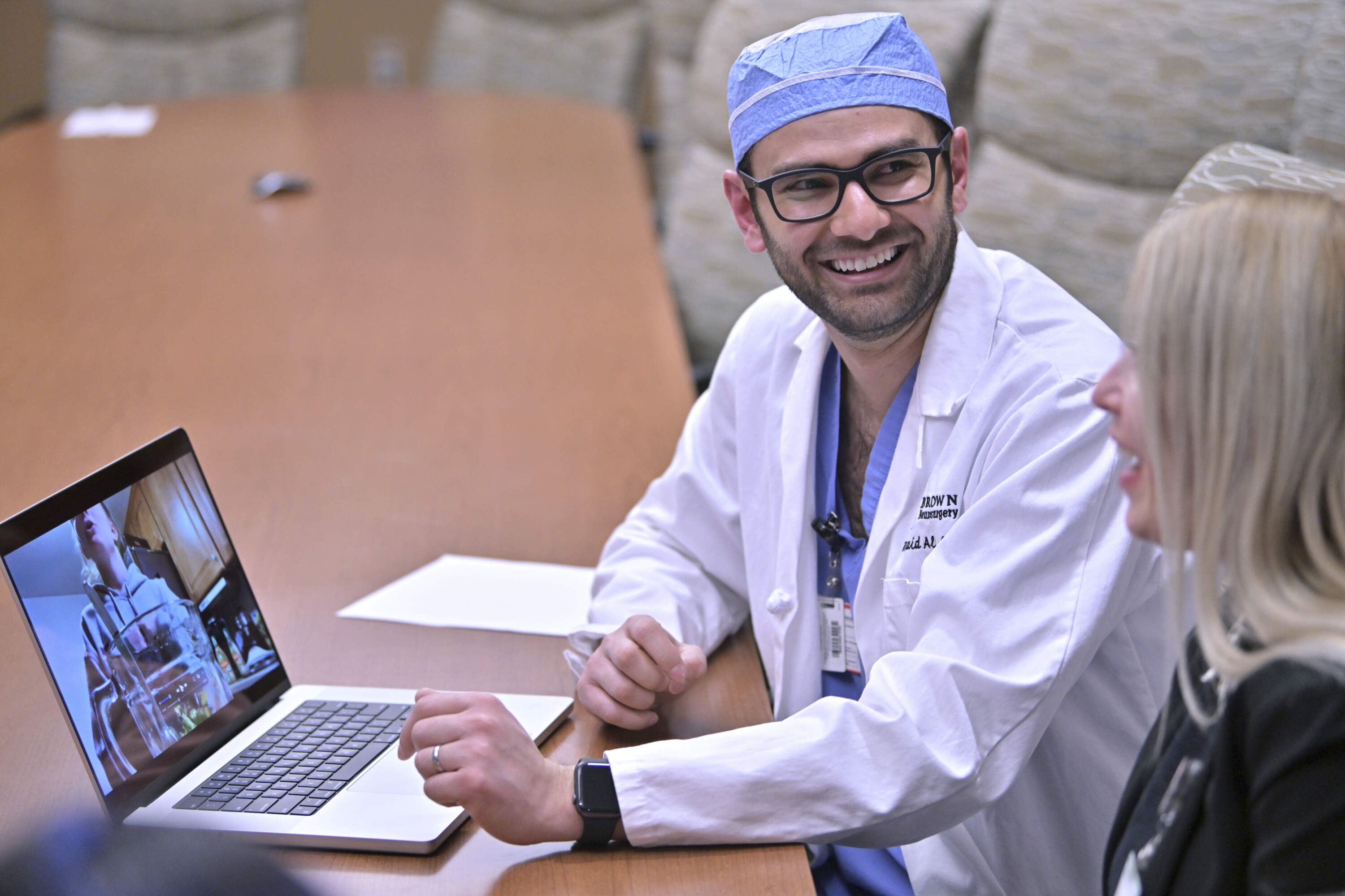 Dr. Rohaid Ali plays a video from a high school project made by his patient Alexis Bogan on Thursday, March 11, 2024, at Rhode Island Hospital in Providence, R.I. (Josh Reynolds/AP)