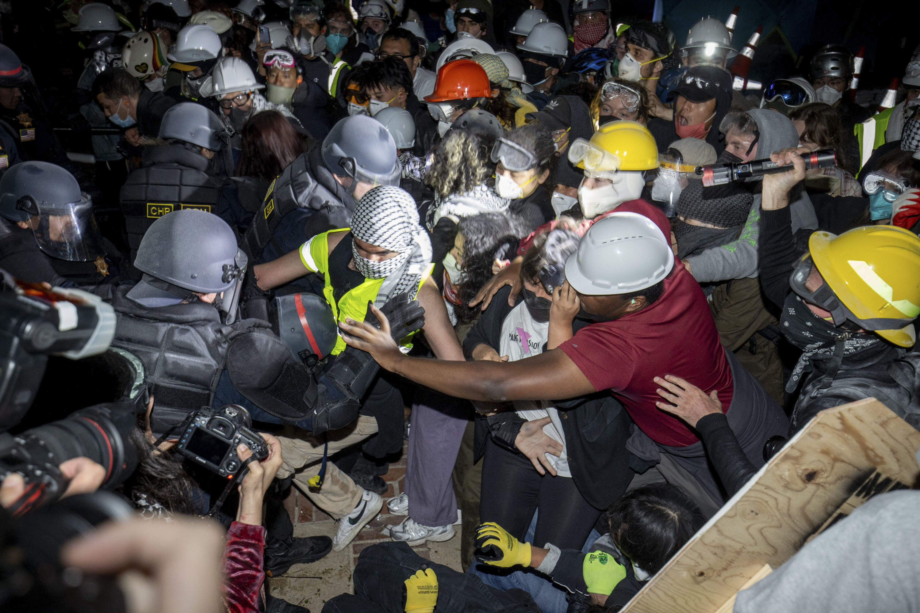 Police advance on pro-Palestinian demonstrators on the UCLA campus Thursday, May 2, 2024, in Los Angeles. (Ethan Swope/AP)