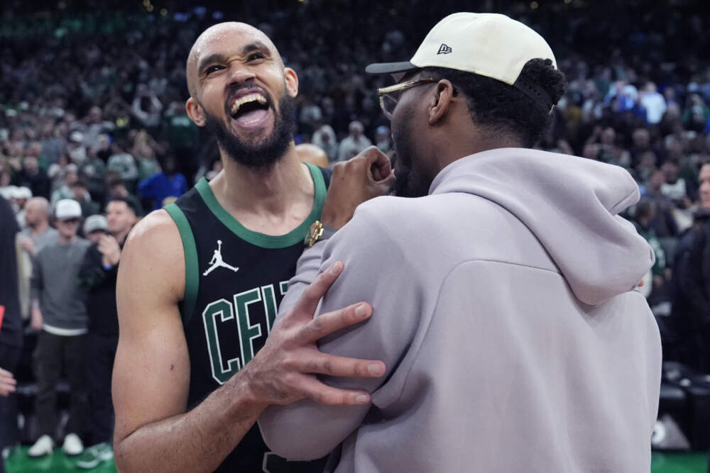 Boston Celtics guard Derrick White, left, embraces Cleveland Cavaliers guard Donovan Mitchell after the Celtics won in Game 5 of an NBA basketball second-round playoff series. (Charles Krupa/AP)