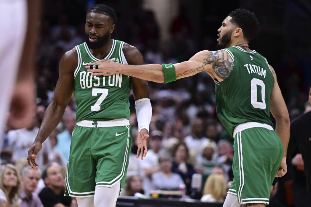 Boston Celtics guard Jaylen Brown (7) is congratulated by forward Jayson Tatum (0) after a after a 3-point basket during the second half of an NBA basketball second-round playoff series against the Cleveland Cavaliers. (David Dermer/AP)
