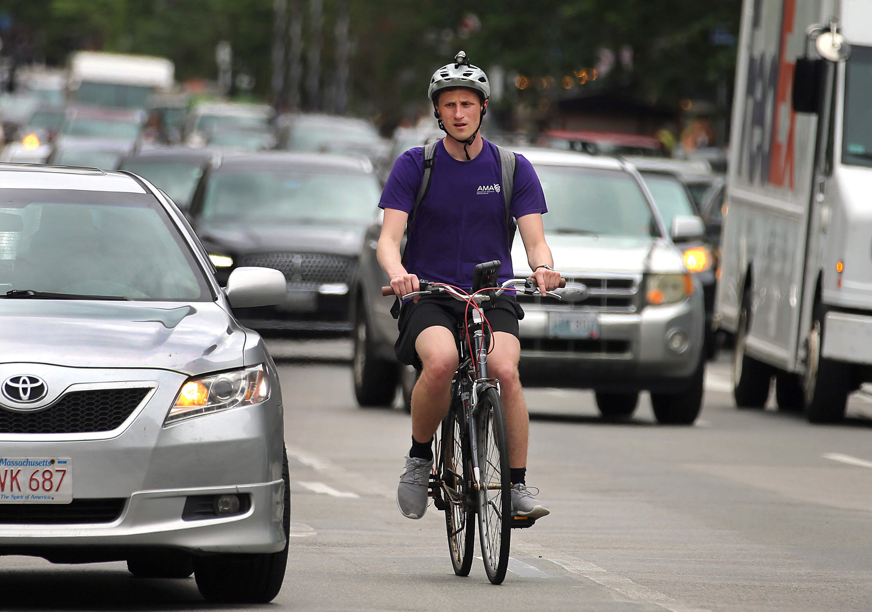 A bicyclist makes their way down Boylston Street. (John Tlumacki/The Boston Globe via Getty Images)