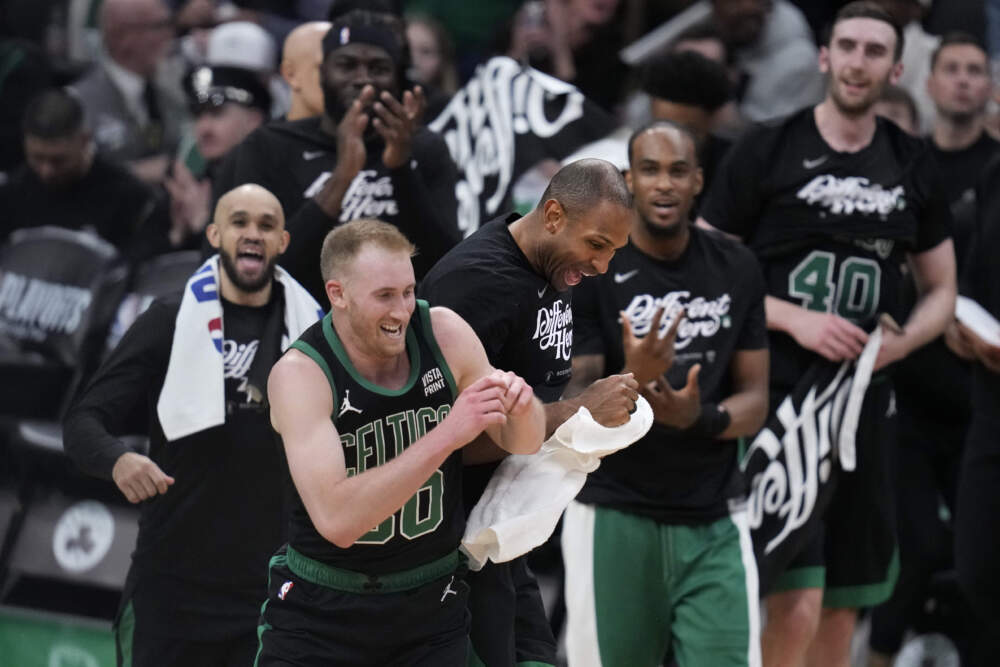 Boston Celtics forward Sam Hauser (30) is congratulated after hitting a 3-pointer against the Miami Heat during the second half of Game 5 of an NBA basketball first-round playoff series. (Charles Krupa/AP)
