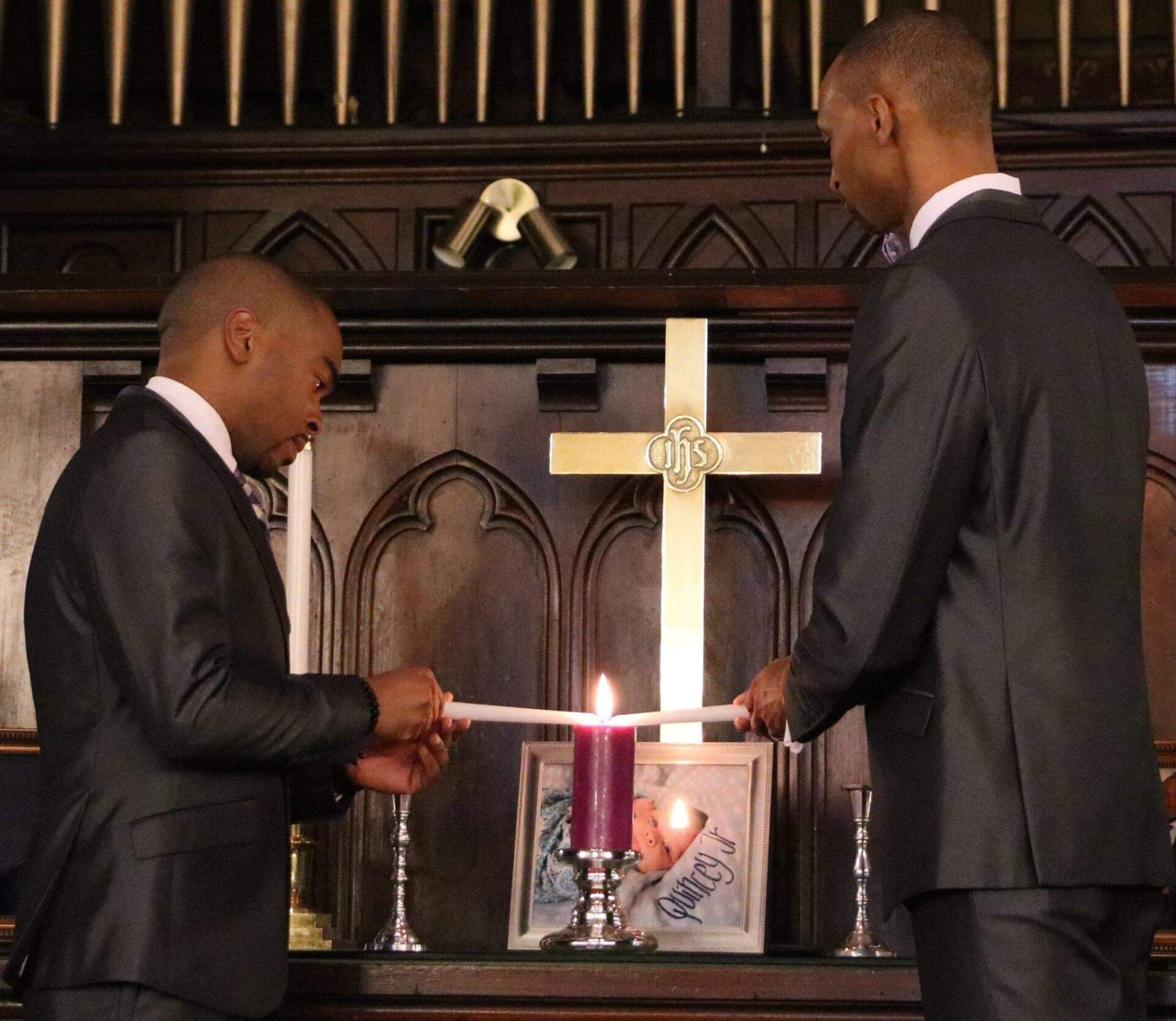 Quincy J. Roberts Sr. and Corey Yarbrough during their wedding ceremony in 2016. (Courtesy of the couple)
