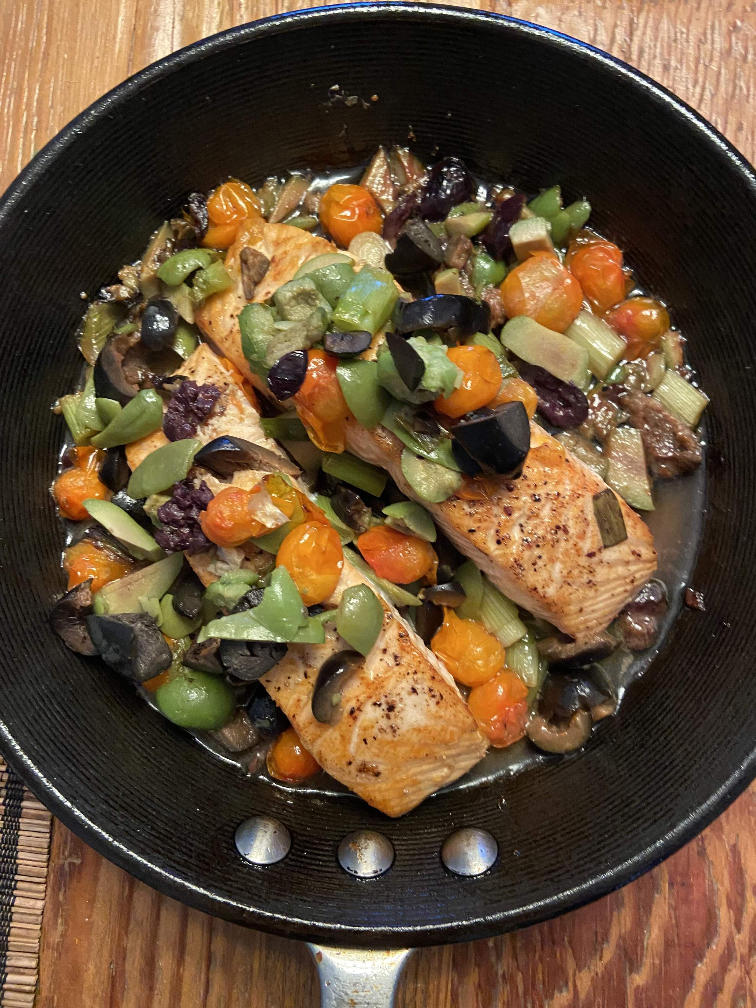 Roasted salmon with three olive, scallion and cherry tomato topping. (Kathy Gunst/Here & Now)