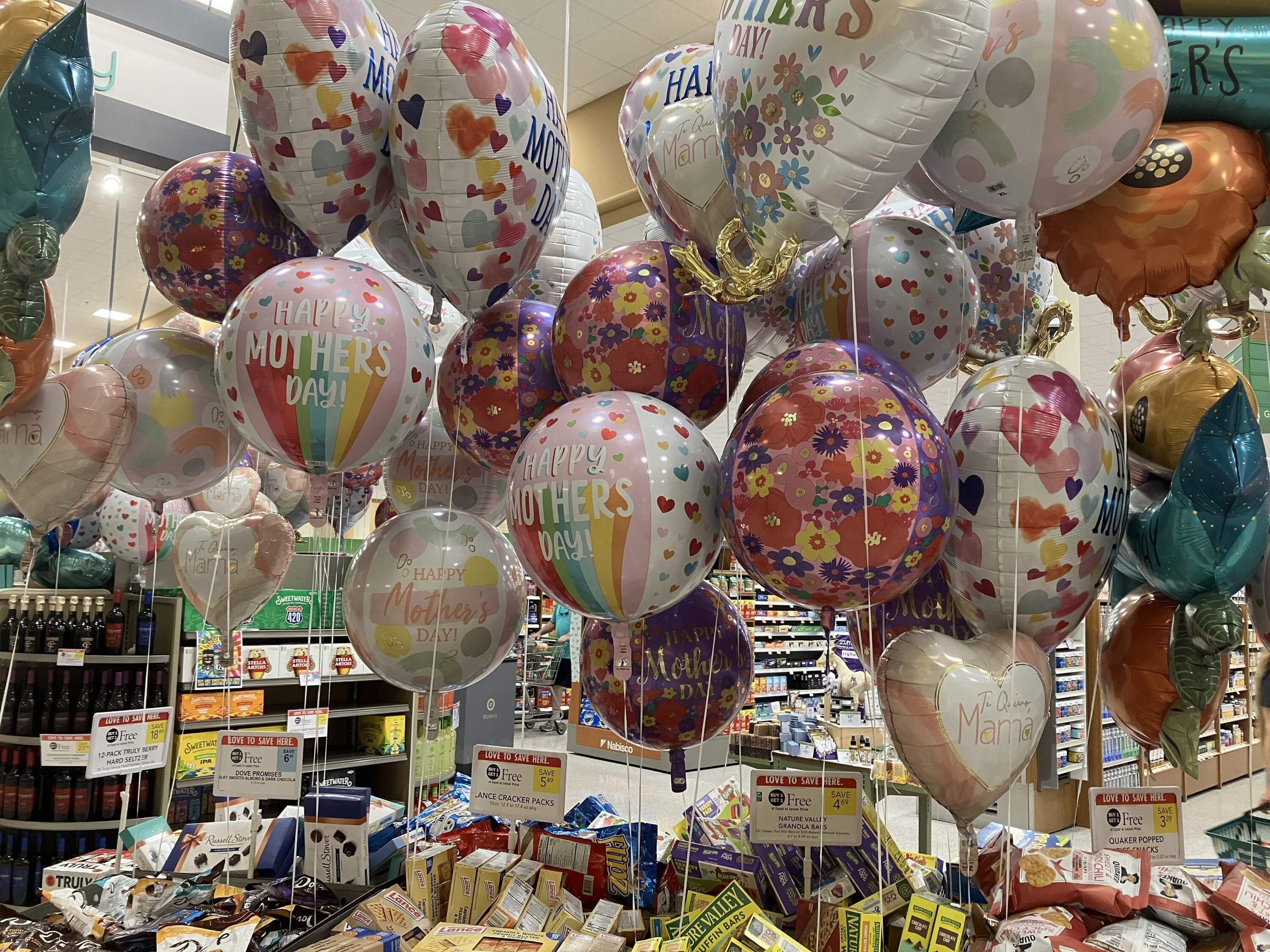 Balloons float at Publix grocery store in Florida. (Catherine Welch/Here & Now)
