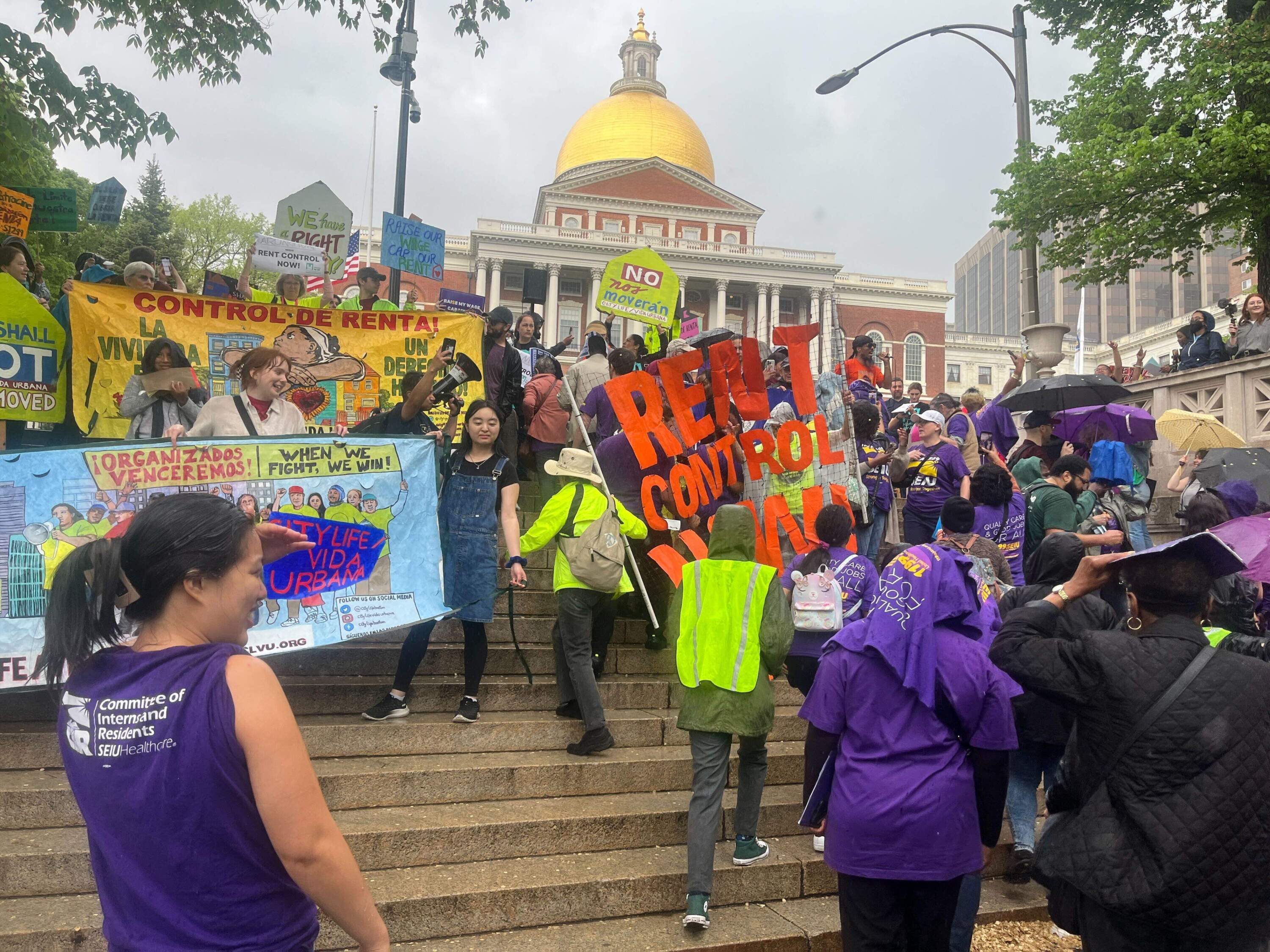 Advocates gather in front of the Massachusetts State House. (Arielle Gray/ WBUR)