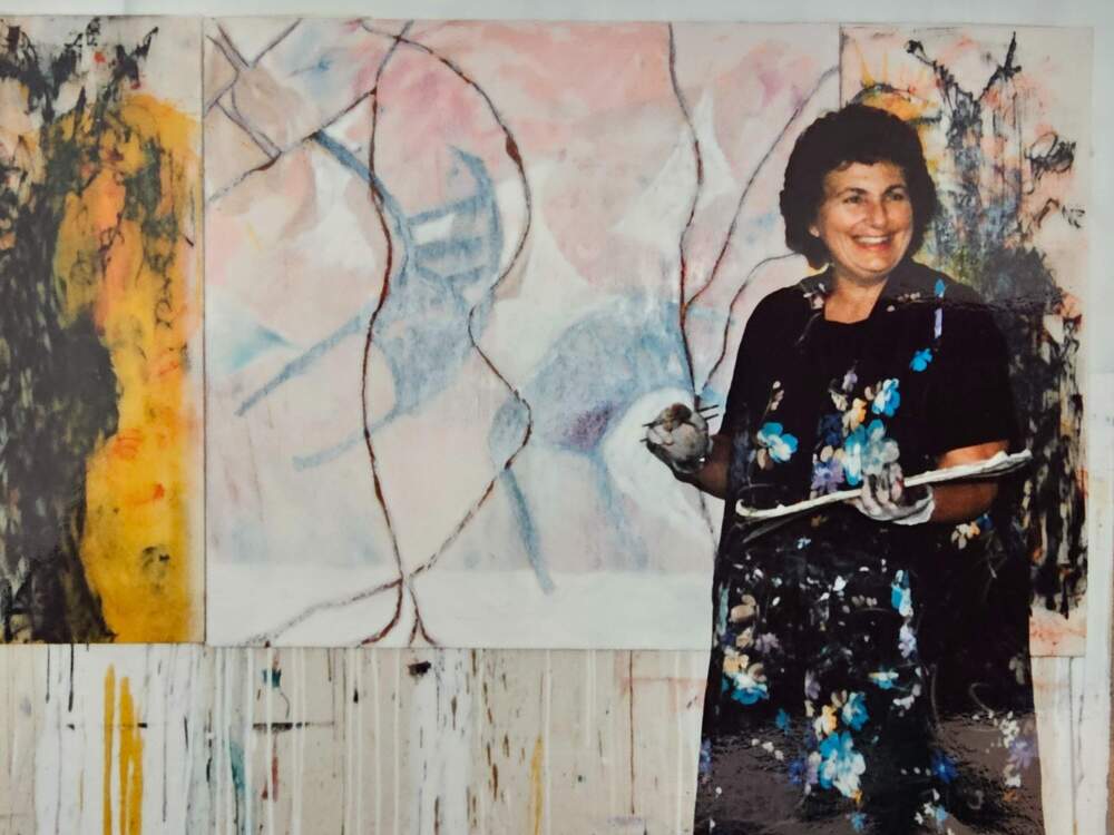 The author's mother, in front of a painting in progress. (Courtesy Julie Wittes Schlack)