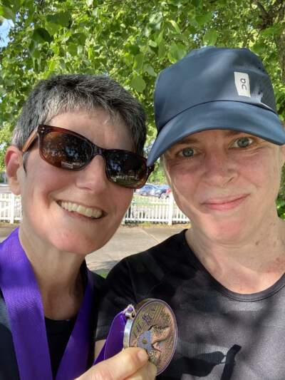 The author (right) with her wife, at the finish line of a recent 5K race. (Courtesy Meaghan Shields)