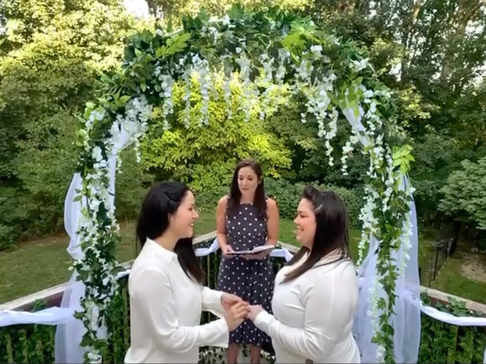 Gaby Leal and Chelsea Wood with their officiant on their wedding day, Sept. 12, 2020, in a screenshot from Zoom. (Courtesy of the couple)