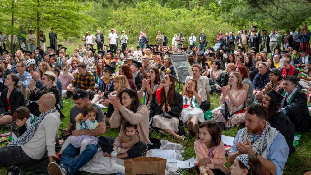 Students, family and friends gather to celebrate graduating UMass Amherst seniors at what organizers called the