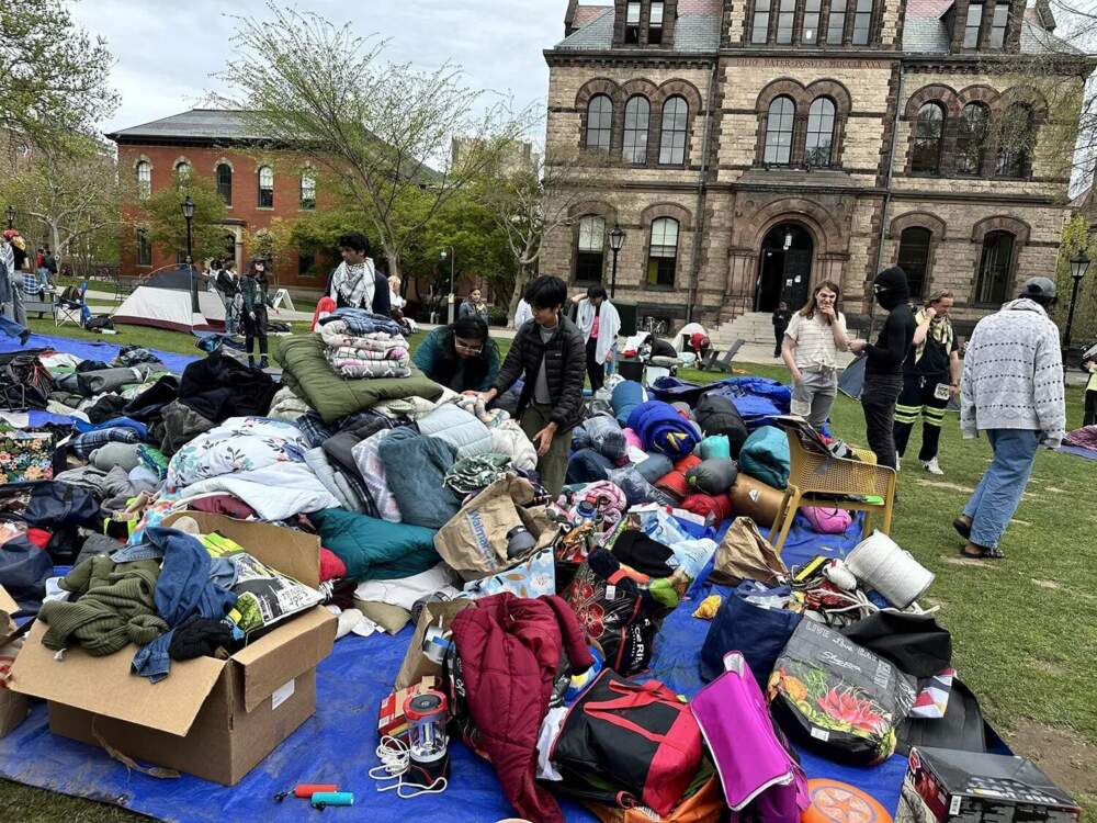 Protesters take down a pro-Palestinian encampment after reaching an agreement with Brown University administrators on April 30, 2024. (Olivia Ebertz/The Public's Radio)