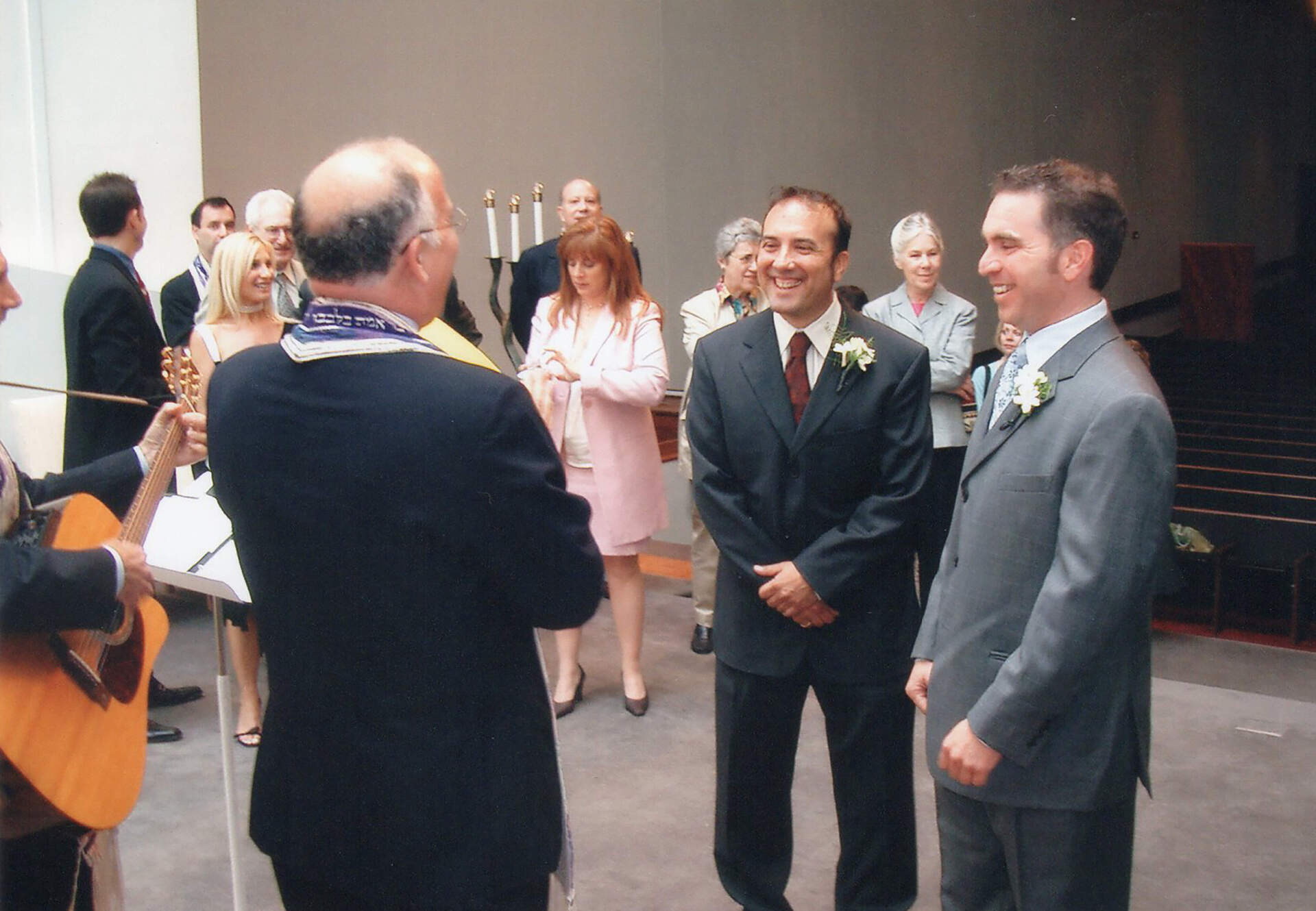 Russ Lopez (center) and Andrew Sherman (right) during their wedding ceremony at Temple Israel in Boston on May 21, 2004. (Courtesy)