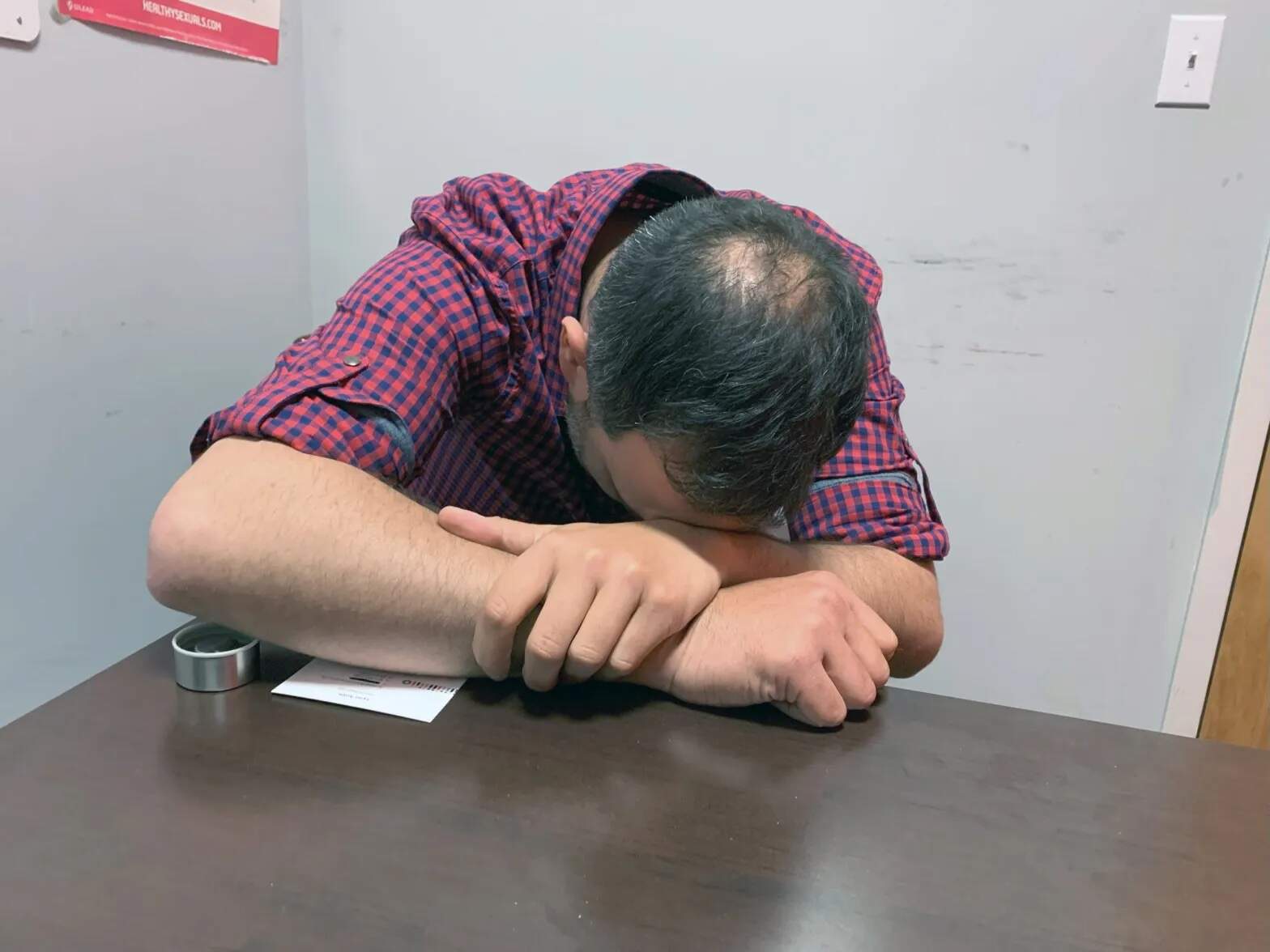 Tyler, 35, got addicted to methamphetamine and wound up homeless last year. He shows how he slept sitting up in the shelters. He now lives in a sober house in Providence, R.I. (Lynn Arditi / The Public's Radio)