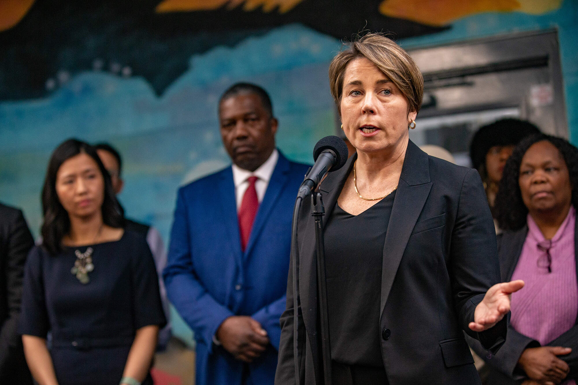 Gov. Maura Healey speaks to the news media regarding transitioning the Melena Cass Recreation Complex into a shelter for the homeless migrants in January. (Jesse Costa/WBUR)