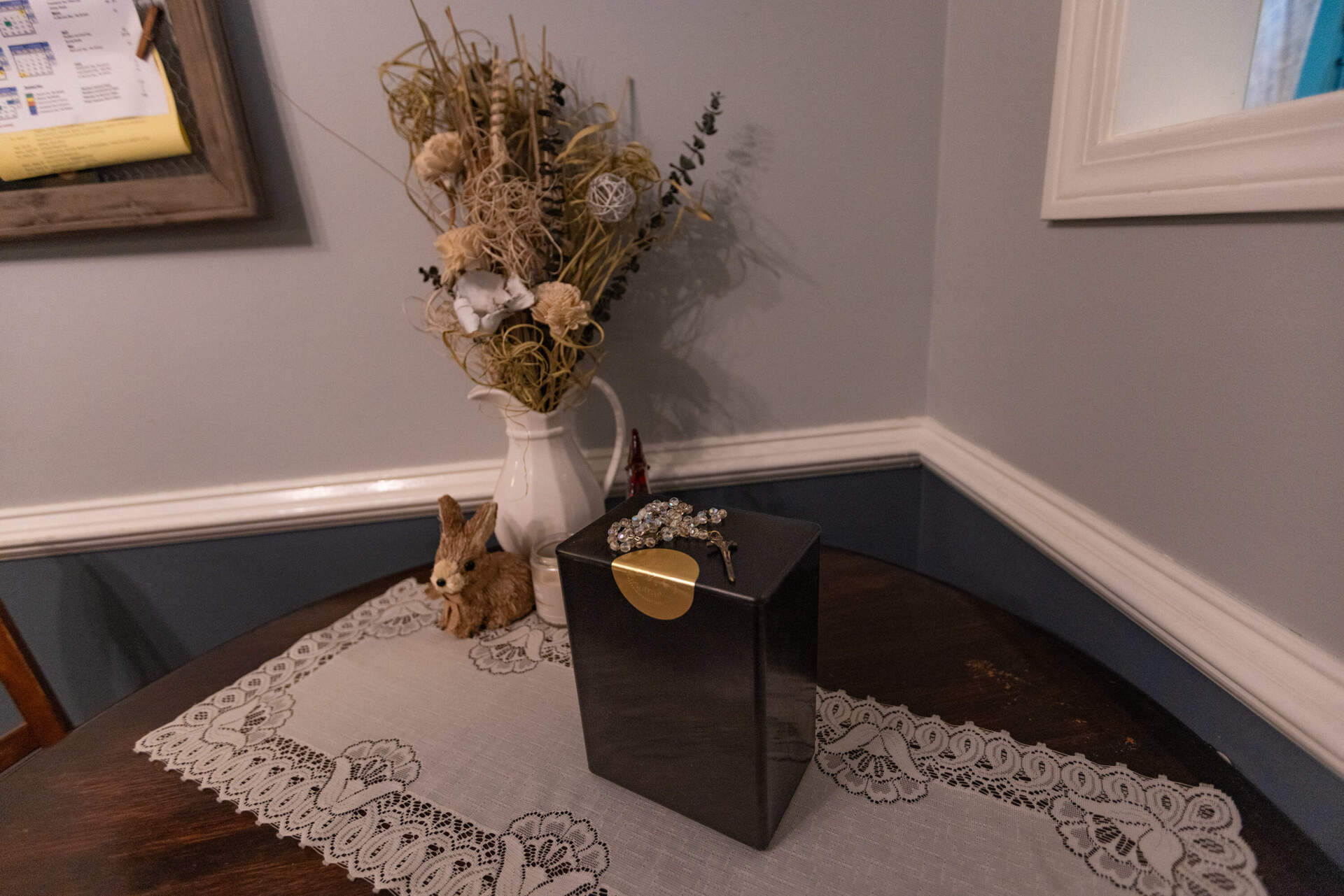 The ashes of Amber Haggstrom’s mother, Donna Pratt, sit in a box at her New Hampshire home. Pratt donated her body to Harvard Medical School. (Jesse Costa/WBUR)