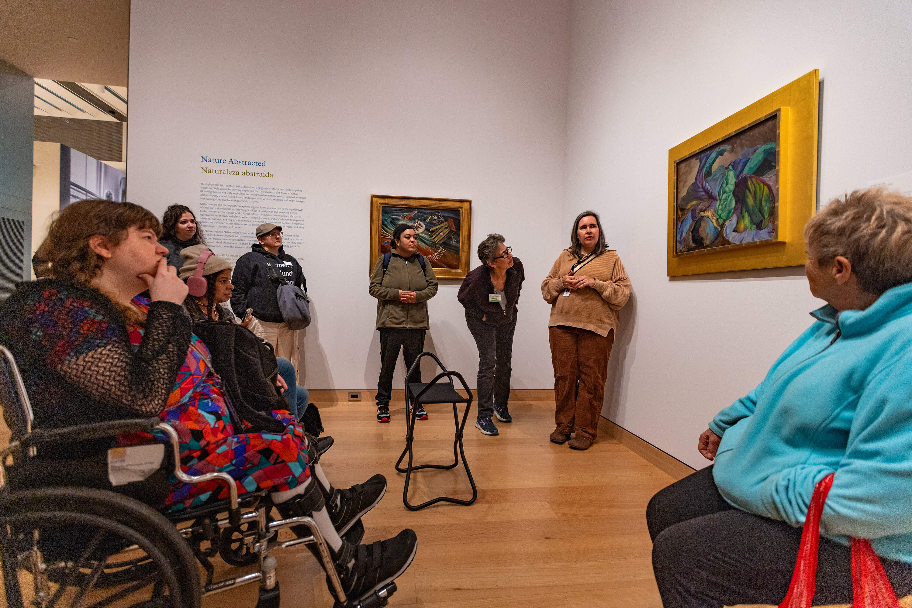 Guide Allison Sillers talks about "Cabbages" by Polly Thayer to patrons of the Women's Lunch Place during a tour at the Museum of Fine Arts, Boston. (Jesse Costa/WBUR)