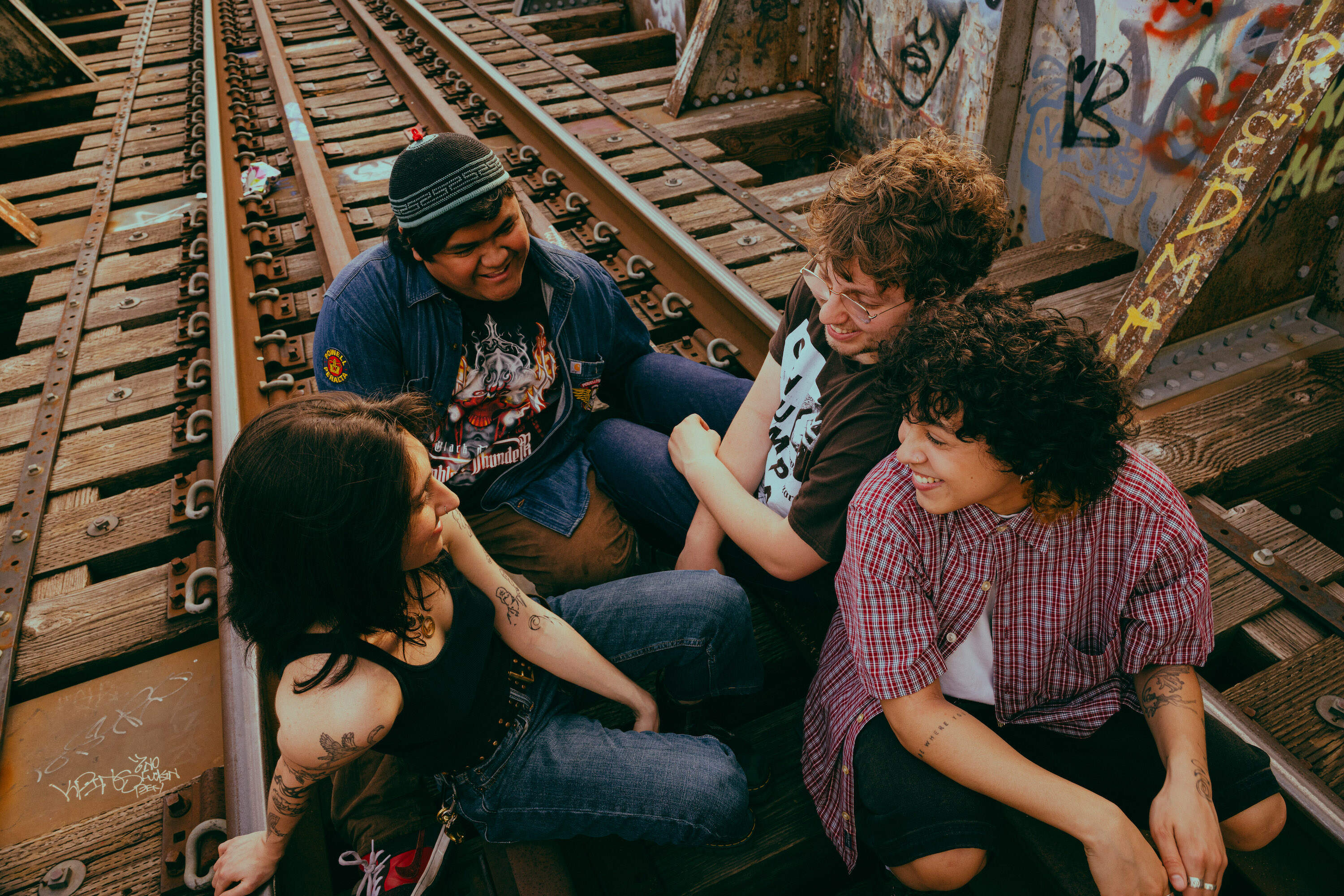 The three founding members of the band, Mena Lemos, Nic Adams and Gibran Mobarak met in high school. Gia Flores, right, joined while the group studied at Berklee. (Olivia Moon Photography for WBUR)
