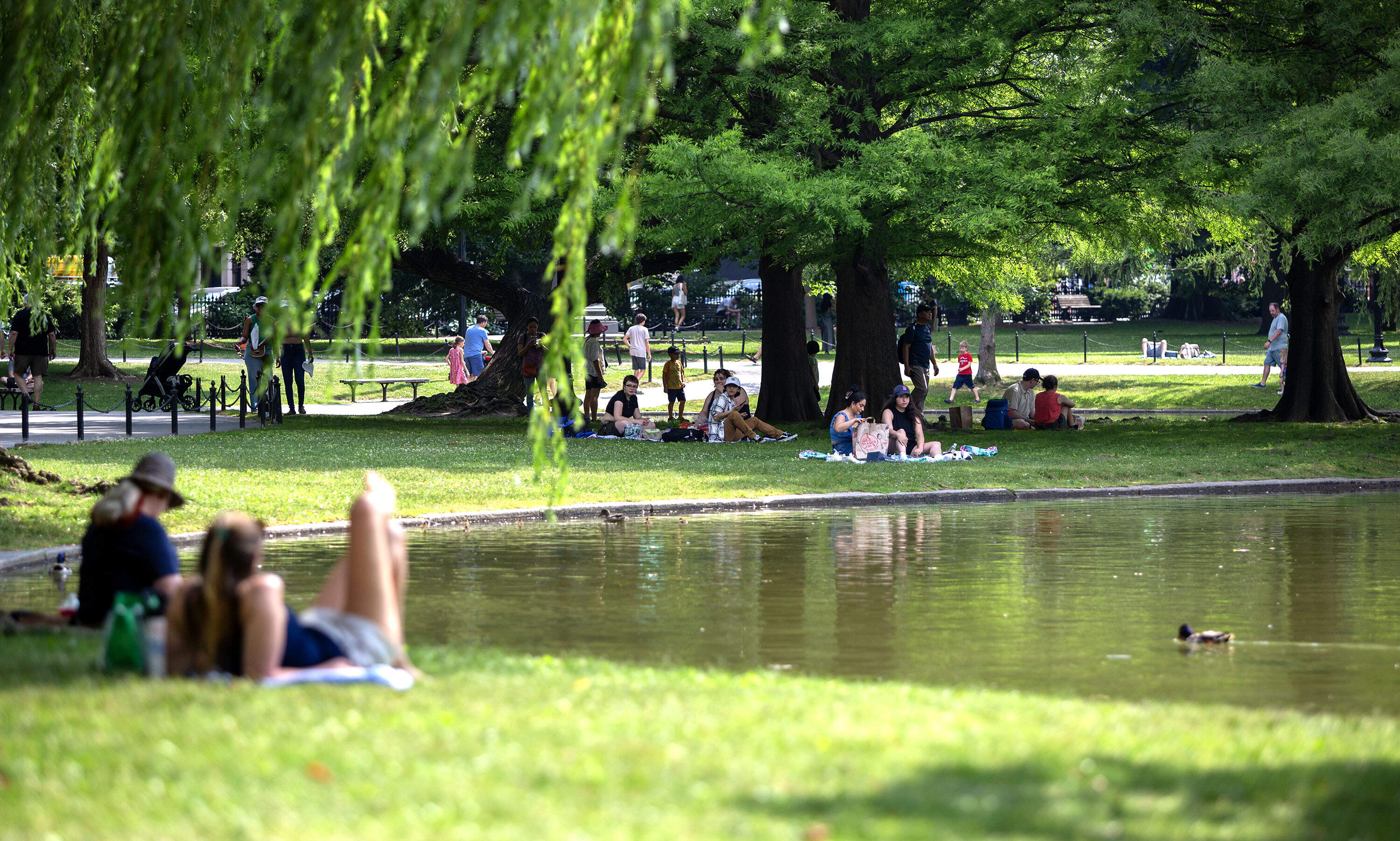 Photos: Residents try to cool down, as expected heat wave keeps up