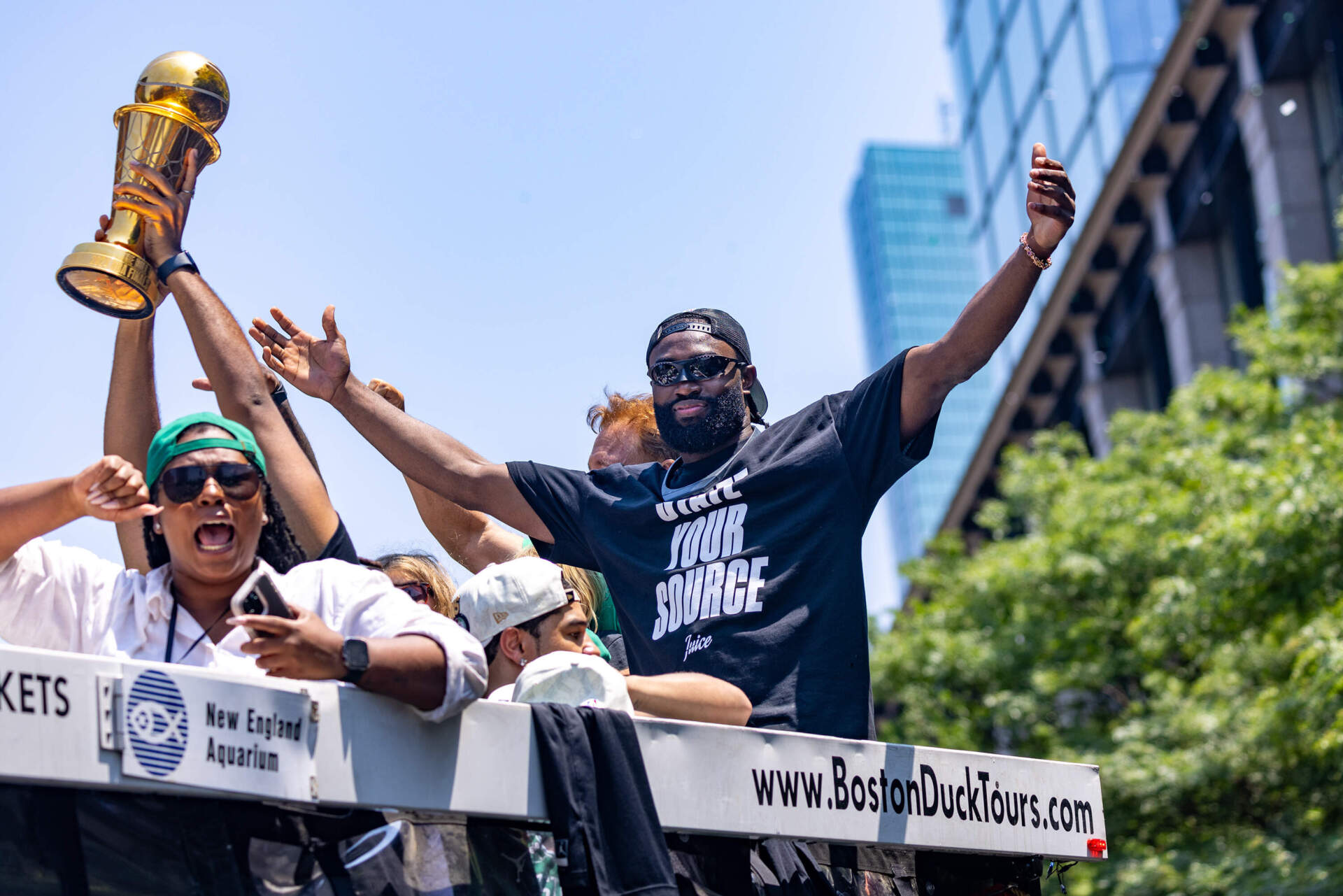 NBA Finals MVP Jaylen Brown celebrates with the crowd on Boylston Street for The Celtics' 18th championship. (Jesse Costa/WBUR)