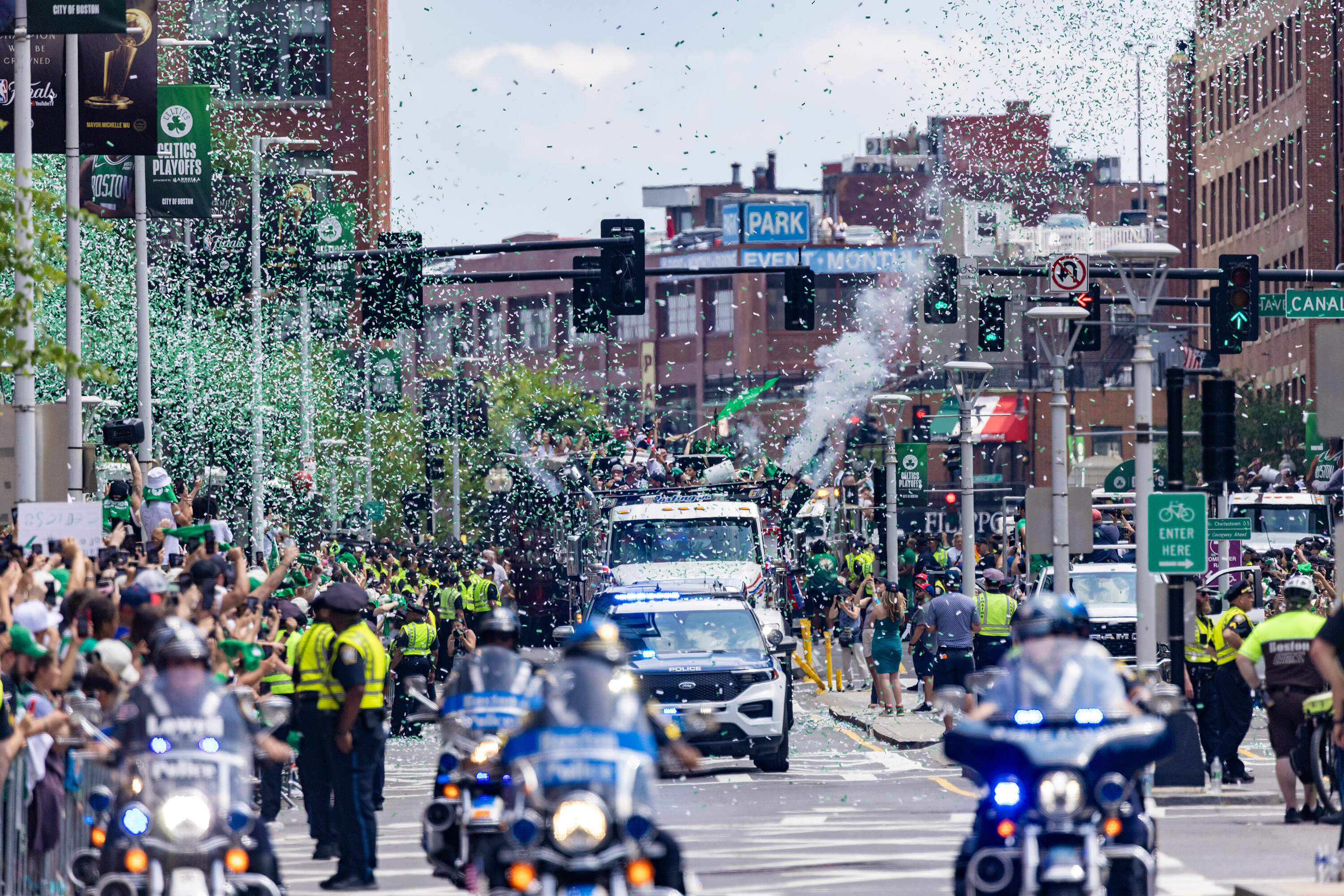 The Celtics rolling rally makes its way down Causeway Street. (Jesse Costa/WBUR)