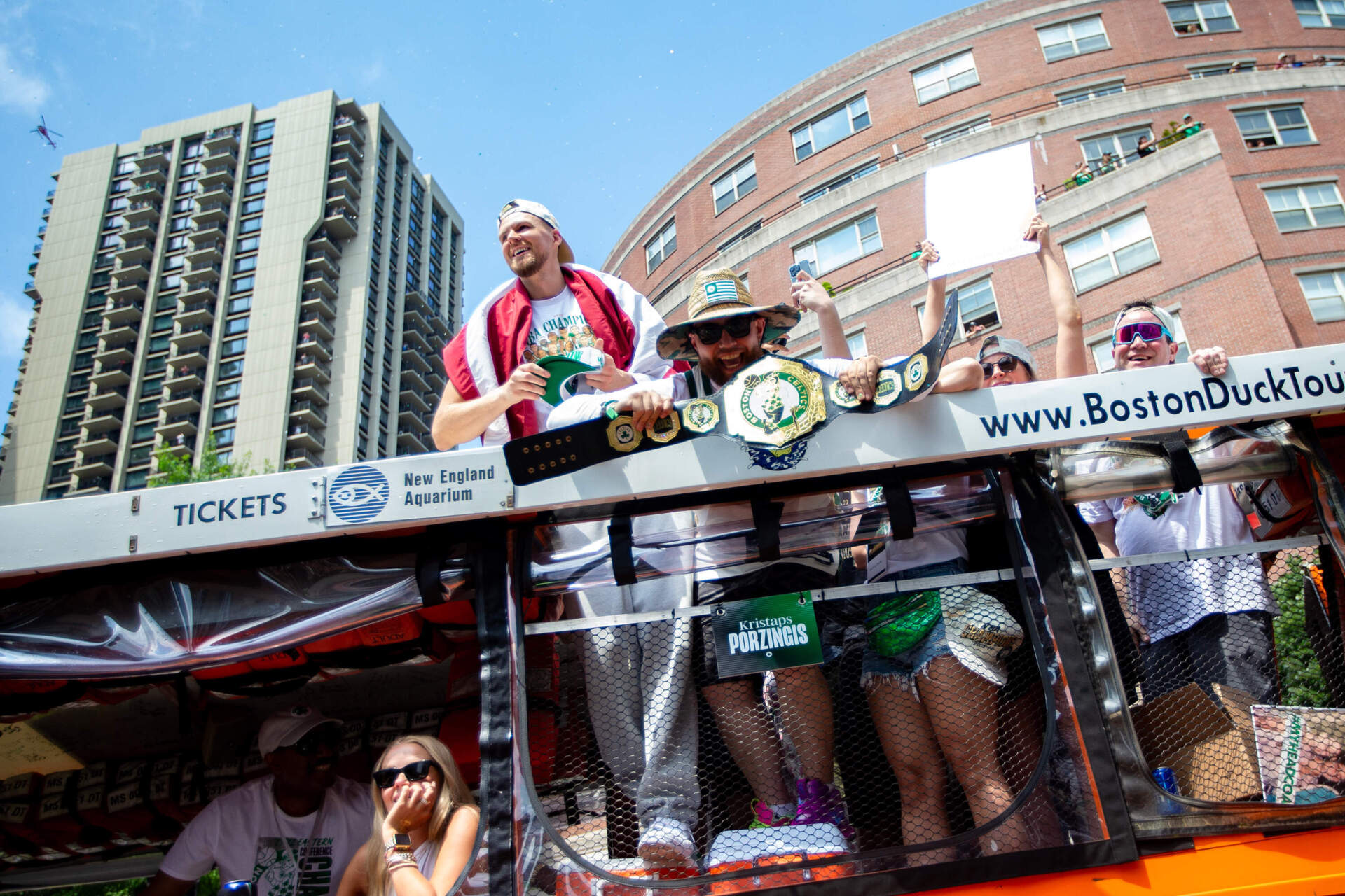 Celtics center Kristaps Porzingas celebrates during the Celtics championship parade in Boston. (Jesse Costa/WBUR)