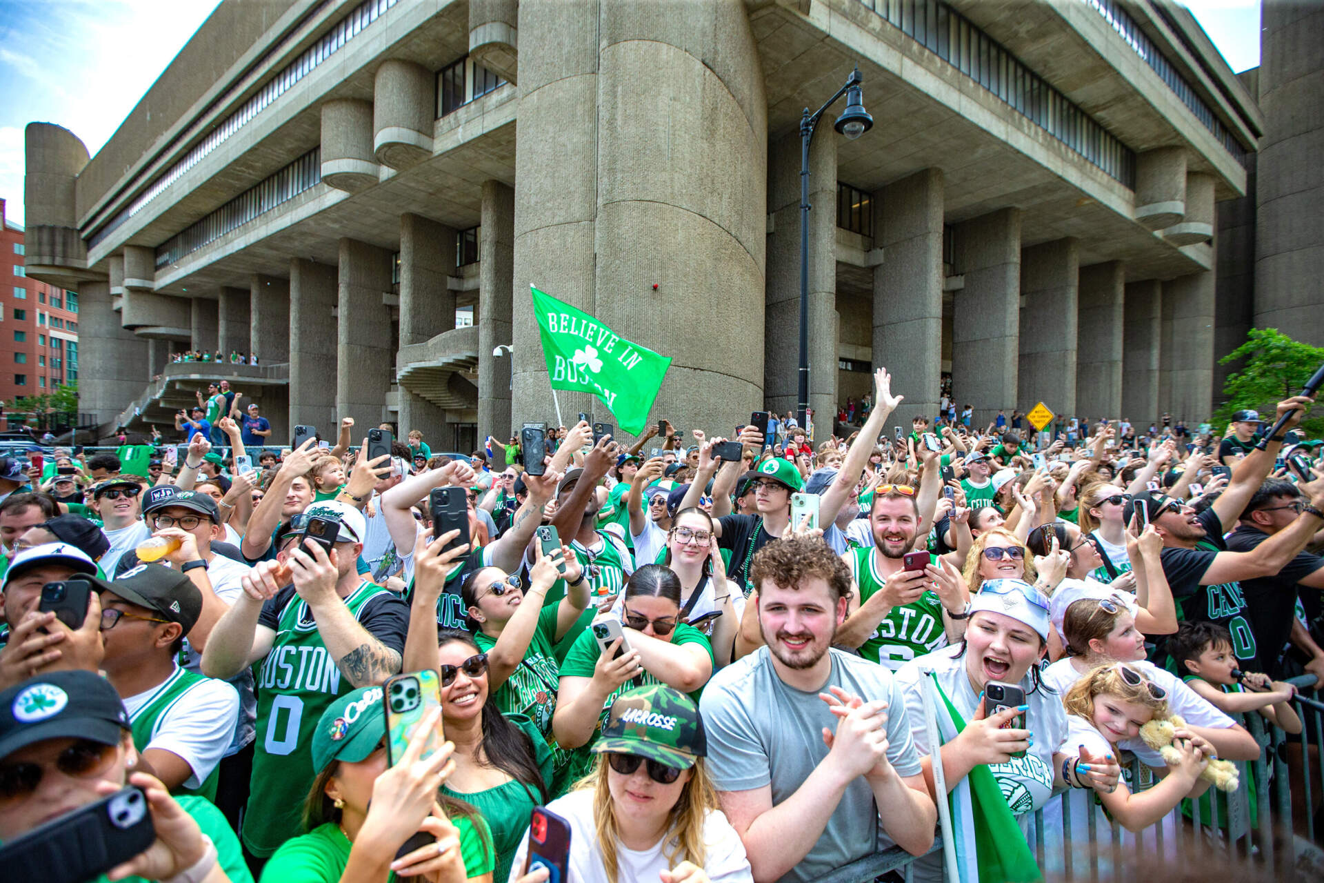Celtic fans along Staniford Street celebrate the 2024 championship with the team. (Jesse Costa/WBUR)