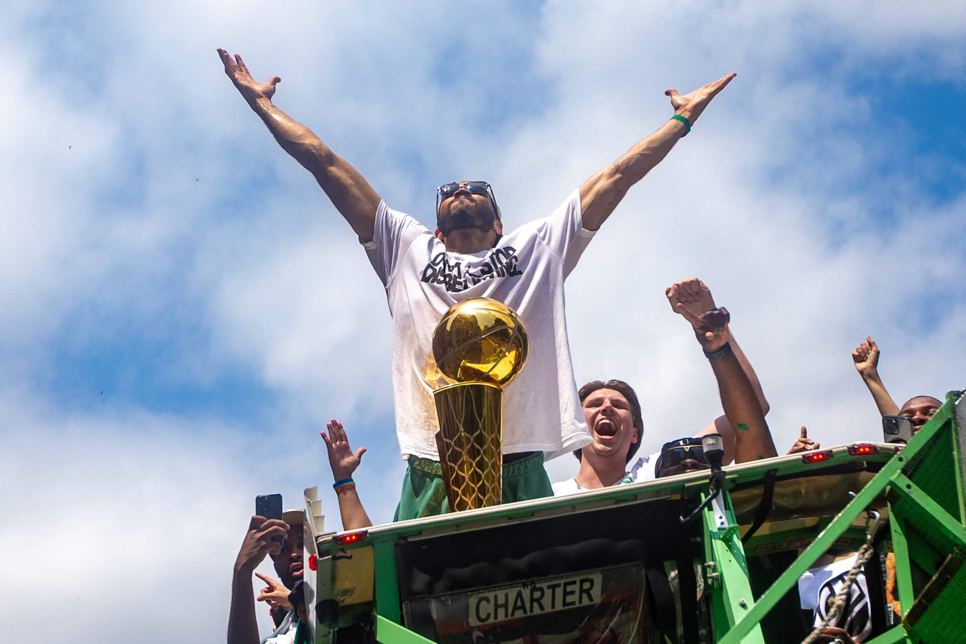 Jayson Tatum celebrates during the Celtics championship parade in Boston. (Jesse Costa/WBUR)
