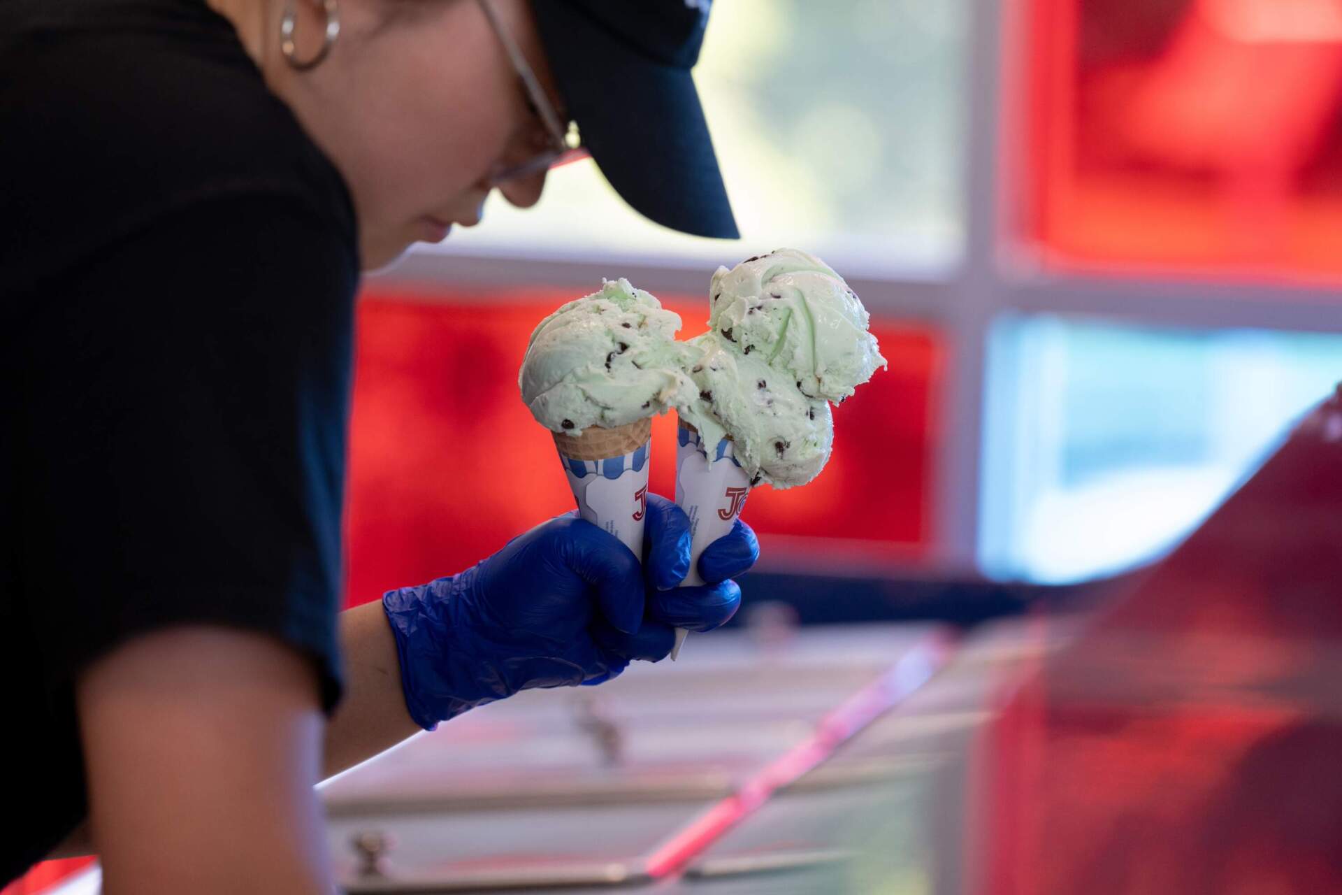UConn student and UConn Dairy Bar employee Janise Park, 21, prepares an ice cream order for a customer at the UConn Dairy Bar in Storrs, Conn. (Raquel C. Zaldívar/New England News Collaborative)