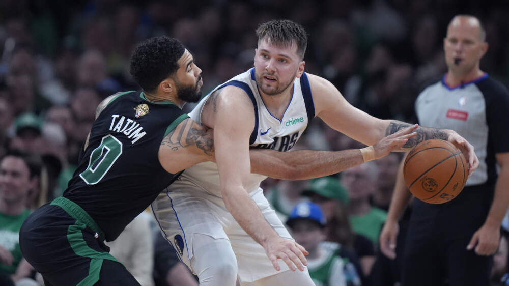 Boston Celtics forward Jayson Tatum pressures Dallas Mavericks guard Luka Doncic during the first half of Game 2 of the 2024vNBA Finals in Boston. (Steven Senne/AP)
