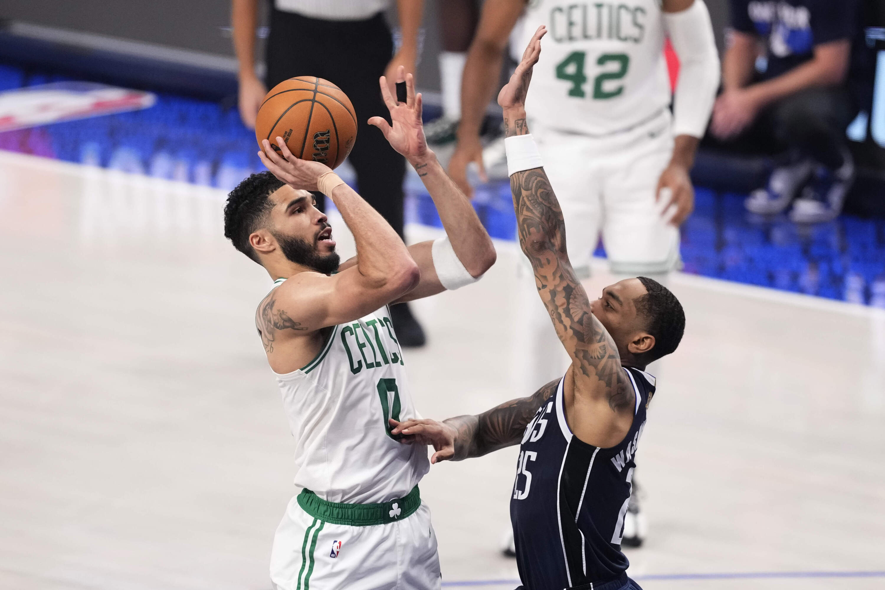 Boston Celtics forward Jayson Tatum shoots over Dallas Mavericks forward P.J. Washington during Game 4 of the NBA Finals in Dallas. (Sam Hodde/AP)