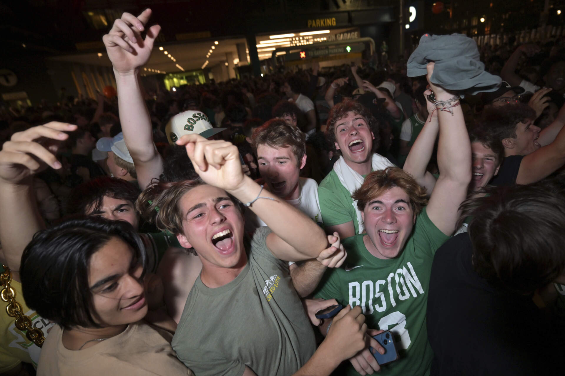 Boston Celtics fans react outside the TD Garden following the team's victory over the Dallas Mavericks in Game 5 of the NBA basketball finals in Boston Monday, June 17, 2024. (Josh Reynolds/AP)