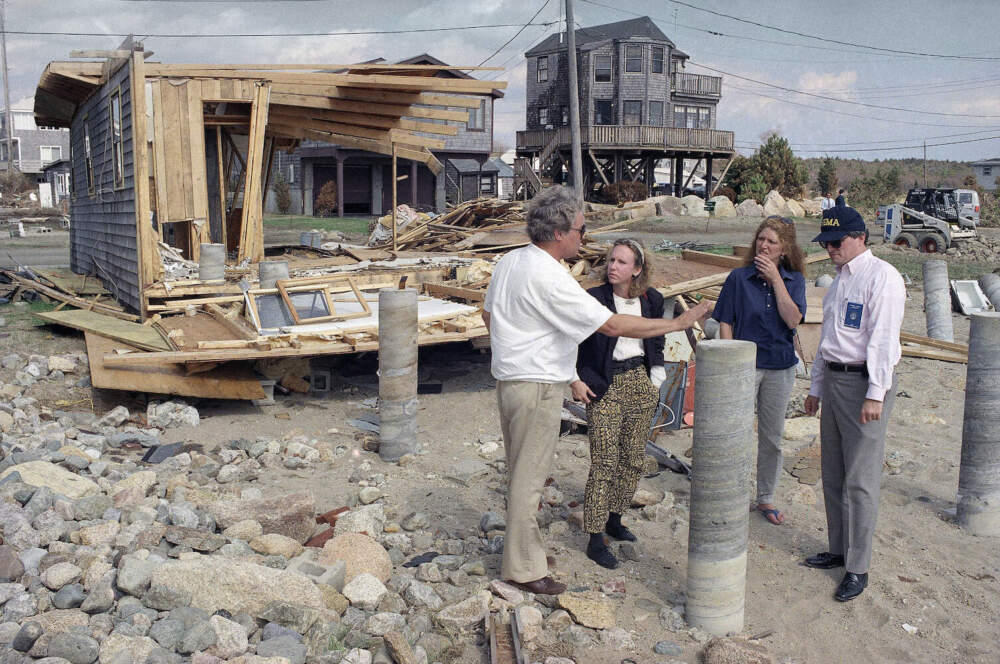 In this September 1991 photo, a former New England regional FEMA official talks with Mattapoisett residents who survived Hurricane Bob. (Stephen Rose/AP)
