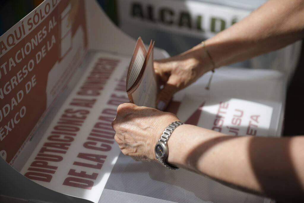 A woman casts her ballot at a polling station, during the 2024 Mexico's general elections. (Daniel Cardenas/Anadolu via Getty Images)