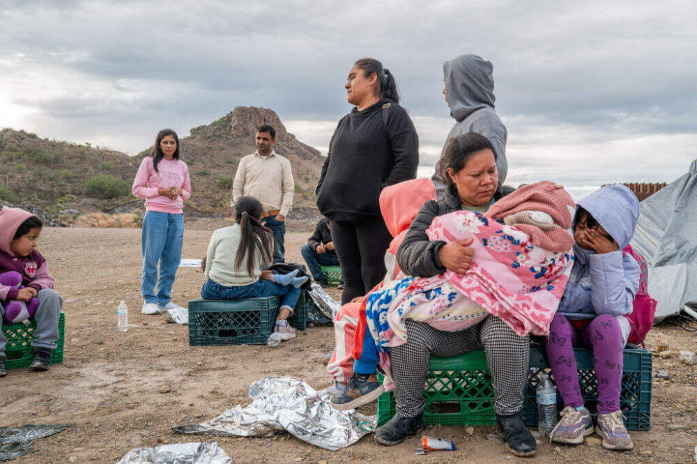 Mexican migrant Veronica Marquez, 36, comforts her son Mariano, 5, while waiting to be apprehended by U.S. Customs and Border protection officers after crossing over into the U.S. on June 25, 2024, in Ruby, Arizona. (Brandon Bell/Getty Images)
