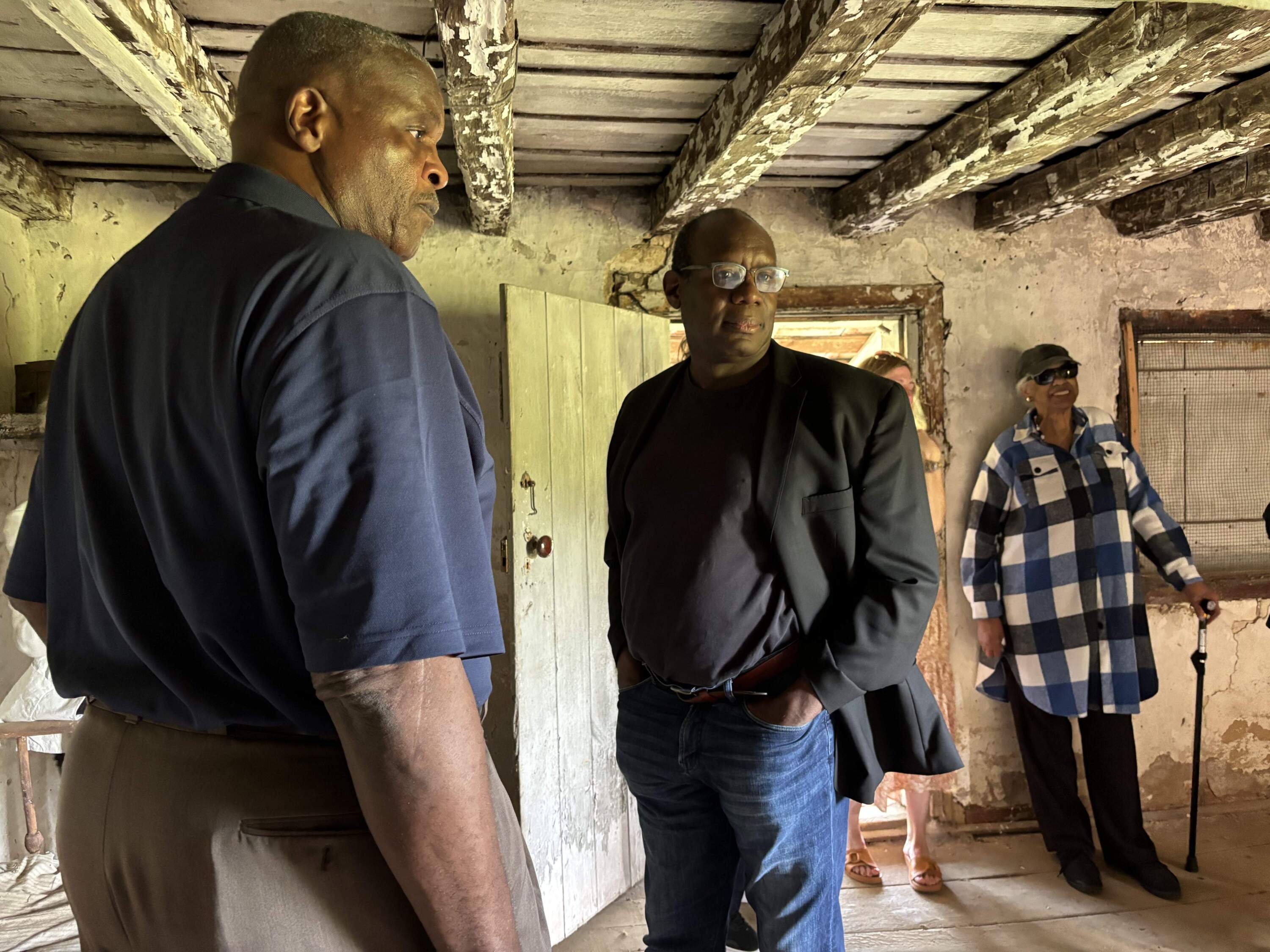 Descendants Stanley Land, David Green and Betty Brown at a Standing Slave House in Brownsburg, Virginia.
(Courtesy of Mary Woodson)