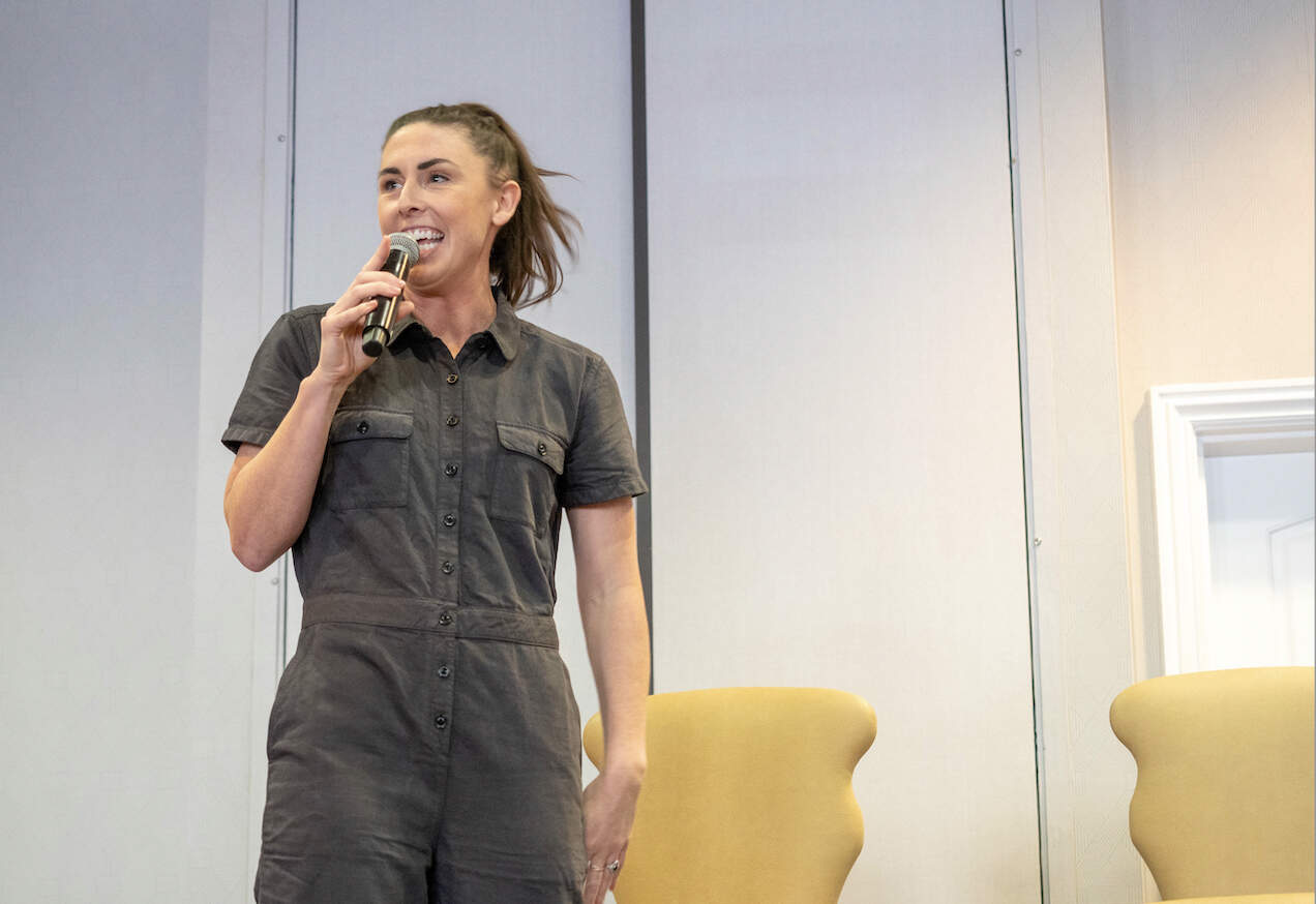 The author warms up a panel at the Napa Valley Marathon health and fitness expo with some stand-up comedy in March 2023. (Courtesy Laura Green)