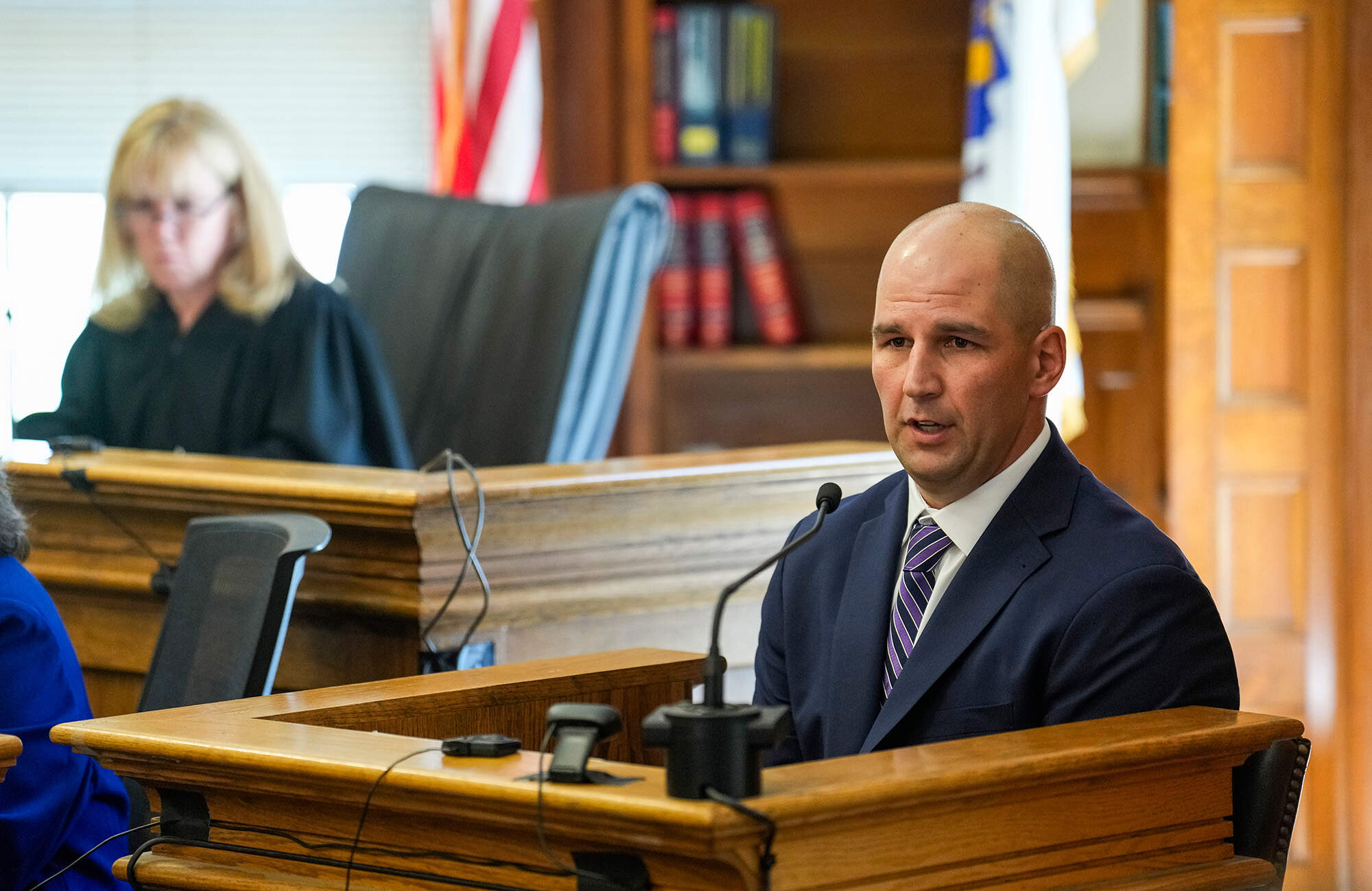 Massachusetts State Police Trooper Michael Proctor, right, takes the stand to testify, Monday, June 10, 2024, in Norfolk Super Court, in Dedham, Mass., during the trial for Karen Read. (Kayla Bartkowski/The Boston Globe via AP)