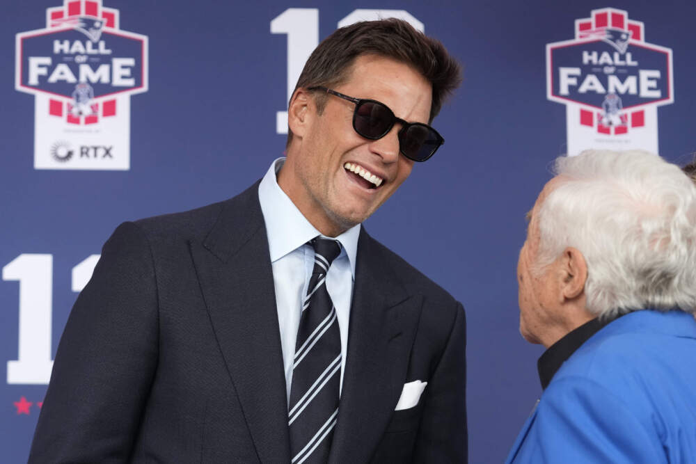 Former New England Patriots quarterback Tom Brady, left, speaks with Patriots owner Robert Kraft as they arrive for the Patriots Hall of Fame induction ceremony. (Steven Senne/AP)