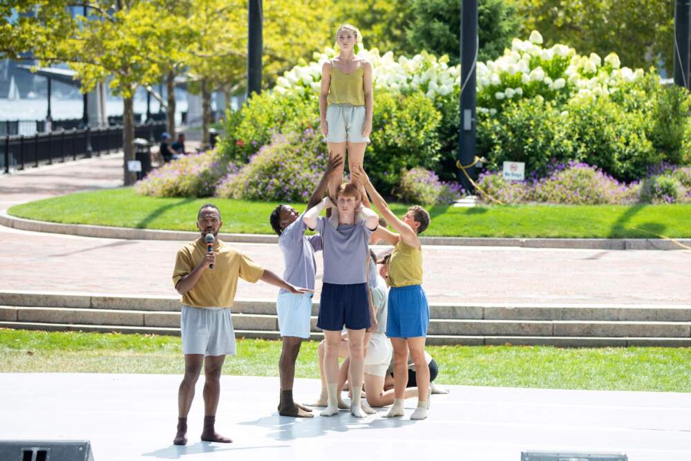Boston Dance Theatre members perform on an outdoor stage in the amphitheater space at Piers Park in East Boston. (Courtesy Sarah Anne Stinnett)