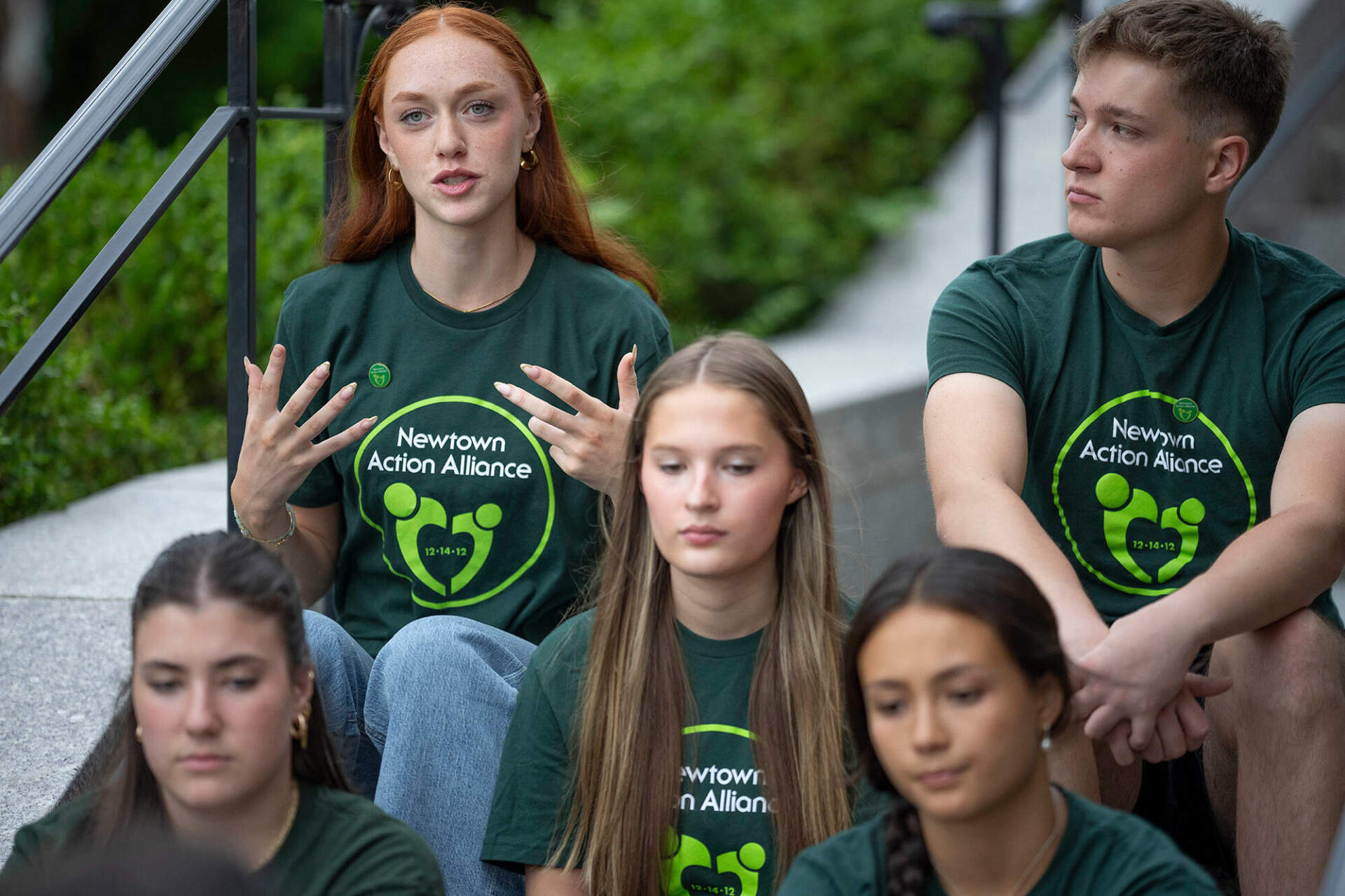Survivors of the 2012 Sandy Hook Elementary School shooting share their thoughts on high school graduation before a rally against gun violence on Friday, June 7, 2024 in Newtown, Conn. (AP Photo/Bryan Woolston)