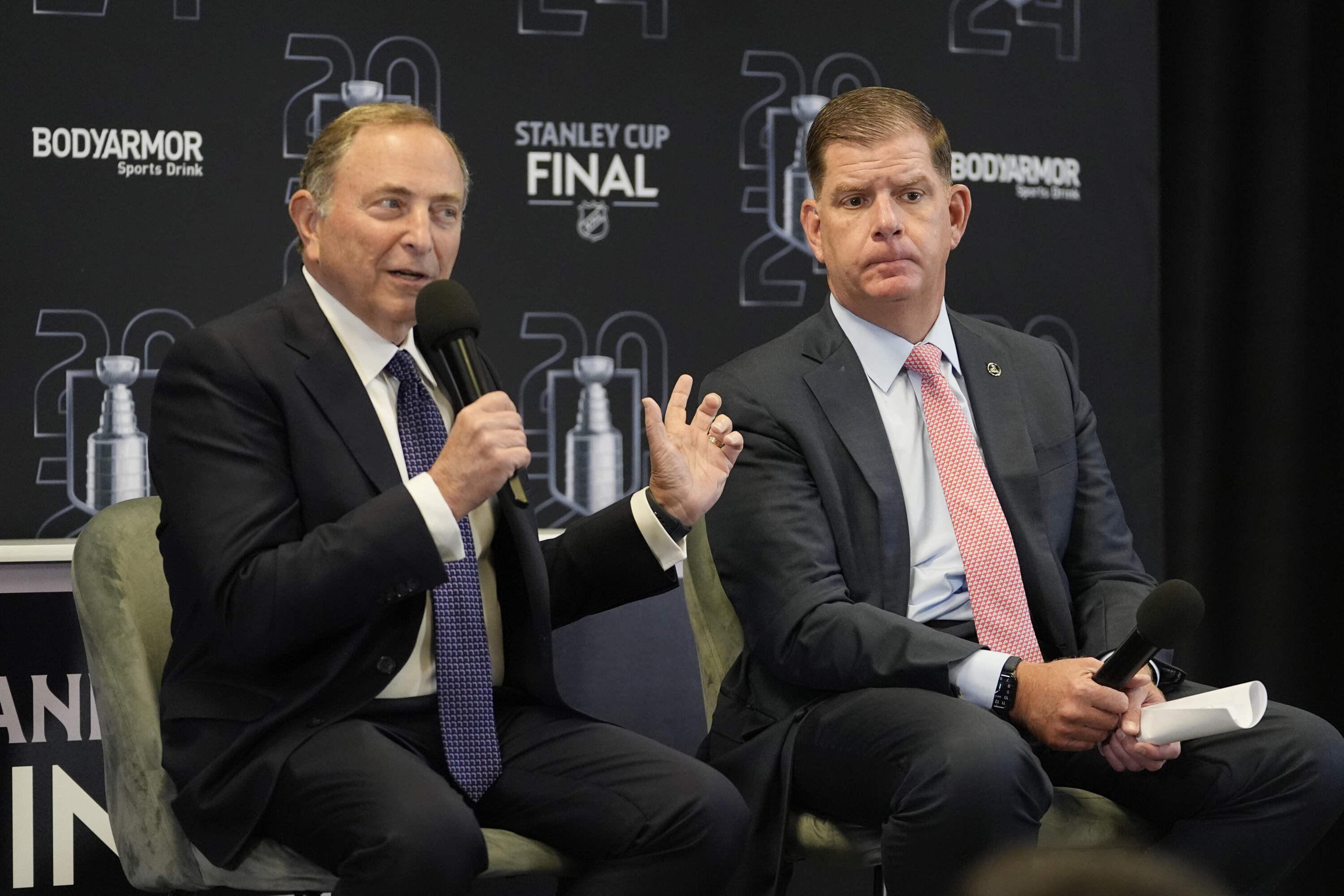 NHL Commissioner Gary Bettman, left, speaks before Game 1 of the NHL hockey Stanley Cup Finals between the Florida Panthers and the Edmonton Oilers Saturday, June 8, 2024, in Sunrise, Fla. At right is former Boston mayor and NHL Players Association Director Marty Walsh. (Lynne Sladky/AP)
