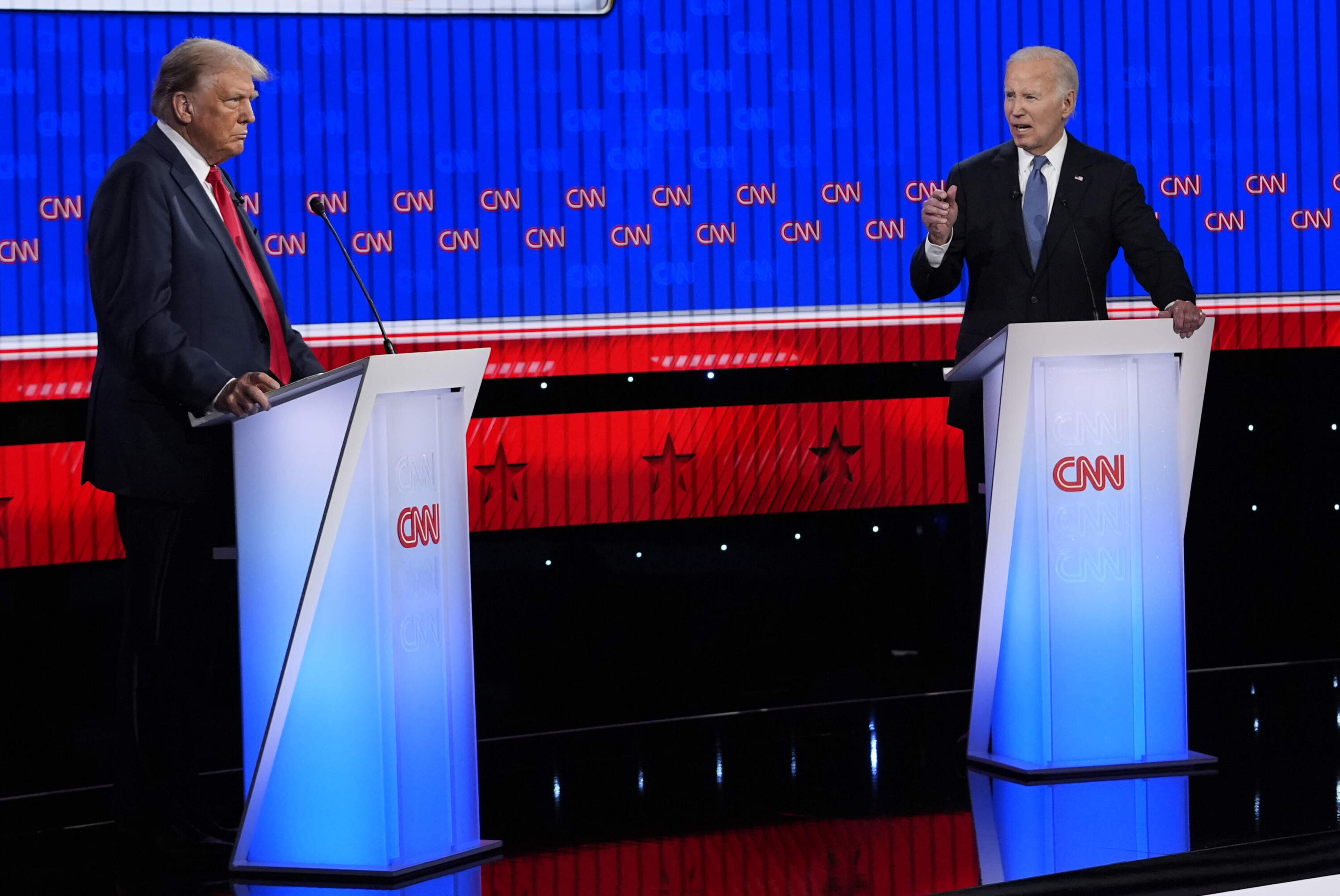 President Joe Biden, right, and Republican presidential candidate former President Donald Trump, left, participate in a CNN debate in Atlanta. (Gerald Herbert/AP)