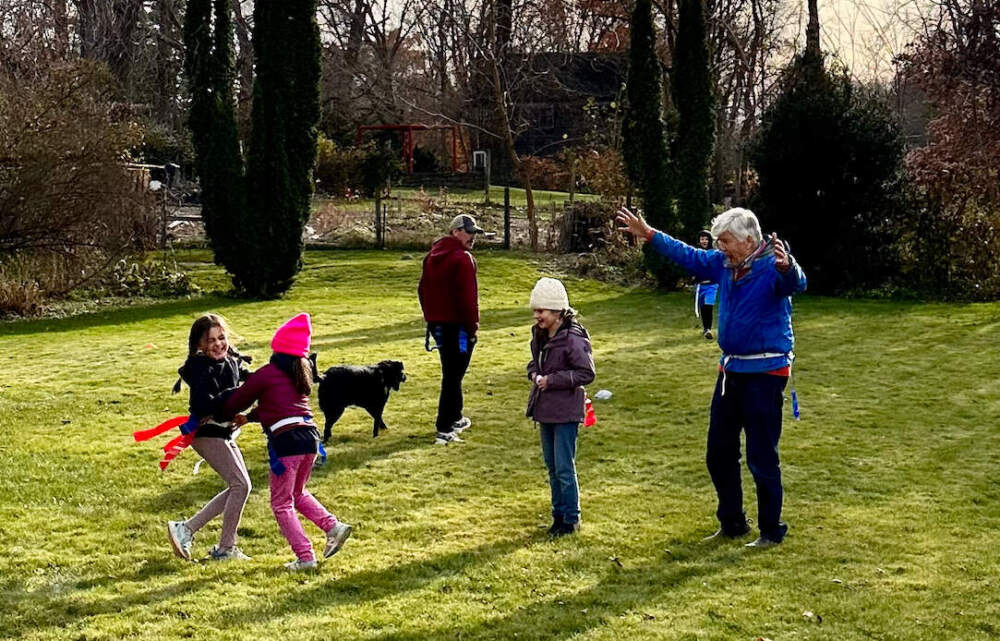 The author's dad, in the blue jacket, orchestrating a family game of flag football in November 2023. (Courtesy Cloe Axelson)