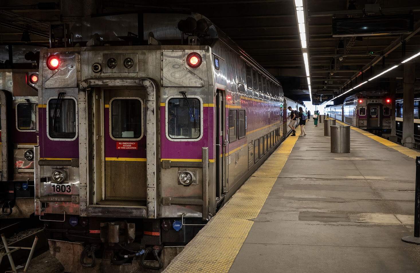 Passengers board a commuter rail train at Boston's South Station. (Robin Lubbock/WBUR)
