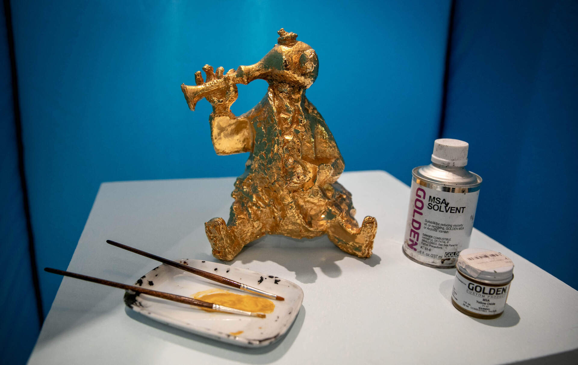 On display at Cambridge Arts' &quot;Rust Happen(s) exhibit, a duplicate of Konstantin Simun's &quot;Fokin Memorial&quot; in Brattle Square with tools required to apply gold leaf. (Robin Lubbock/WBUR)