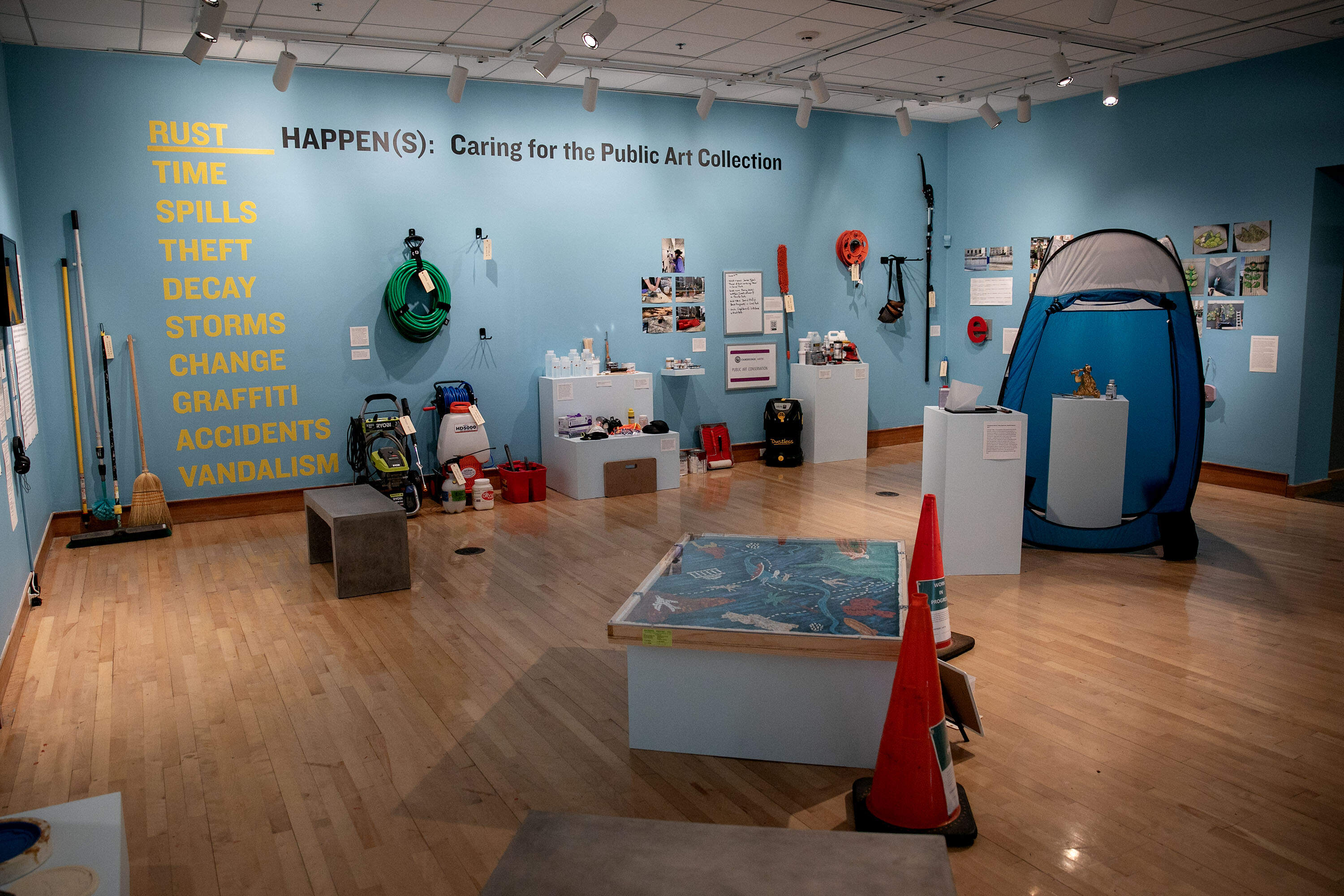 At Cambridge Arts' "Rust Happen(s)" exhibit, arts conservation tools are on display, along with some examples of public art works in the city. (Robin Lubbock/WBUR)