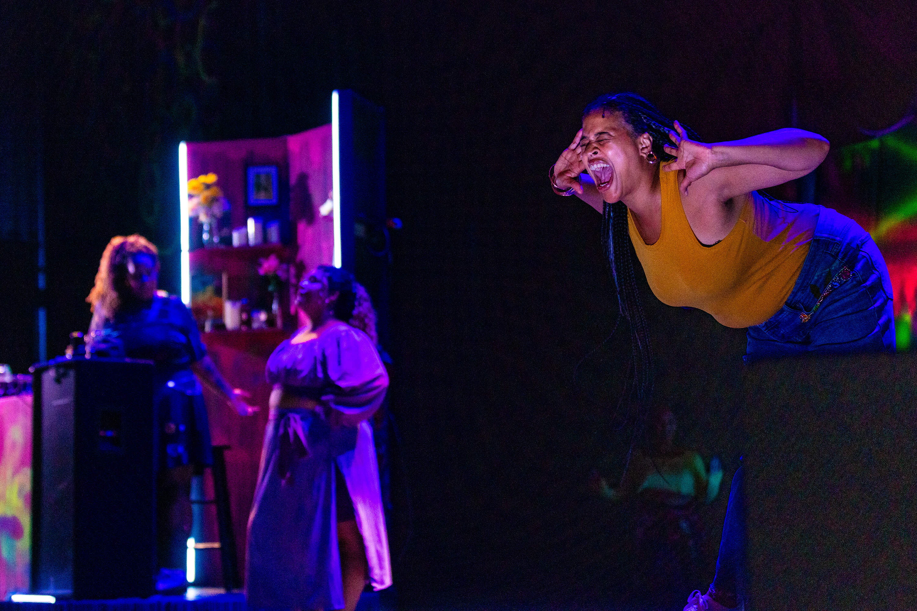 Kaili Y. Turner screams during a scene from the dress rehearsal of "Hoops" at the Strand Theater. (Jesse Costa/WBUR)